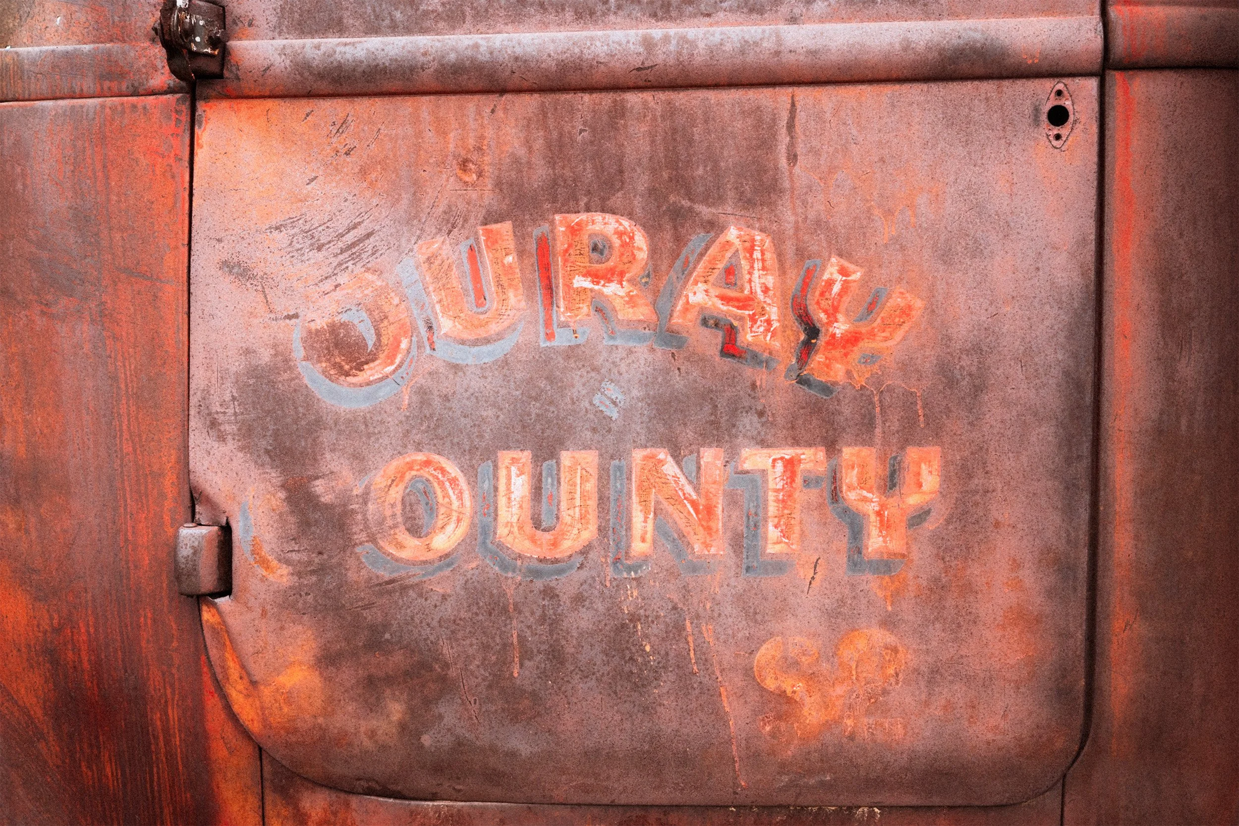 Image of a rusty truck driver's side door.