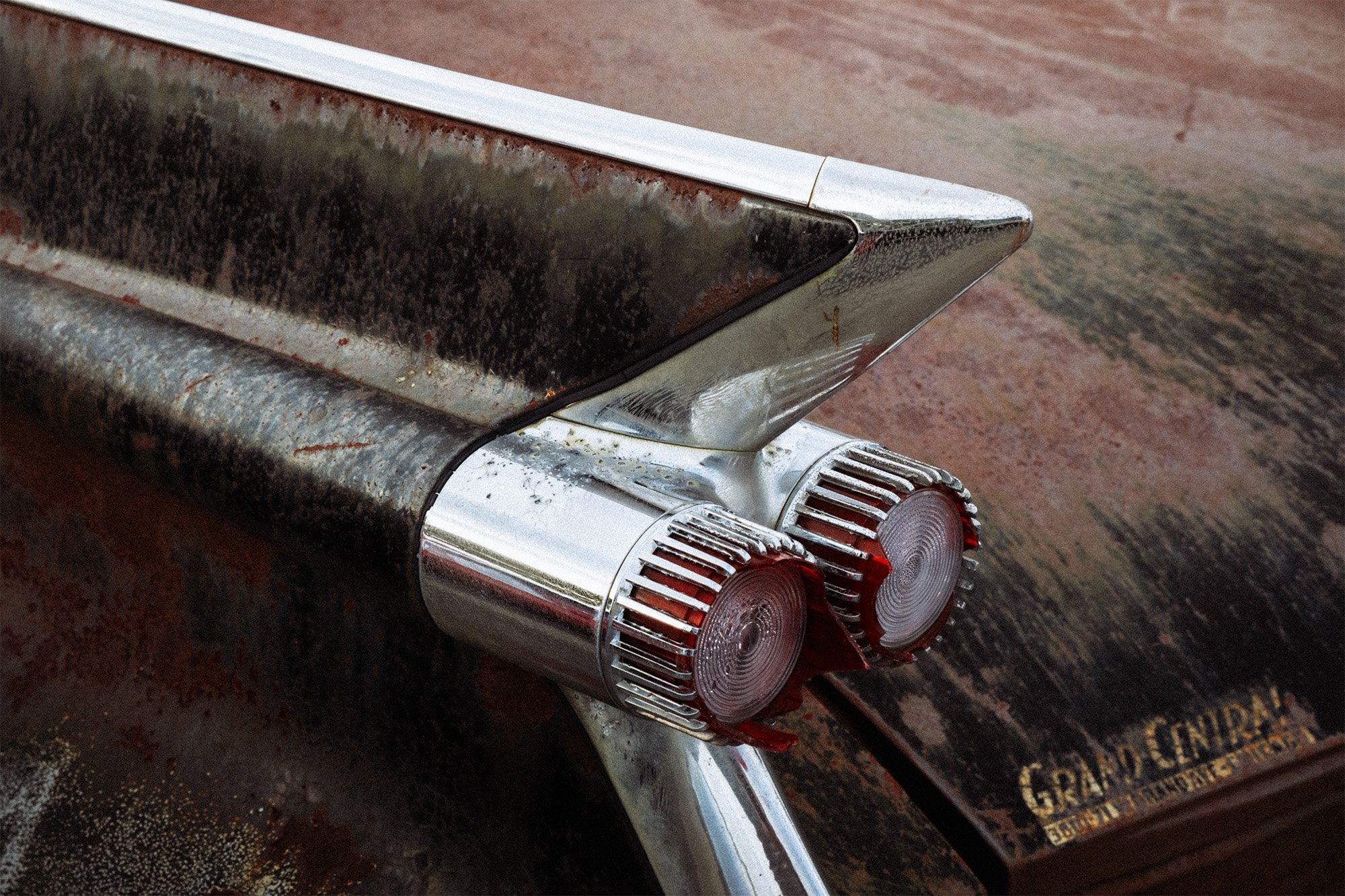 Image of the tailfin of a rusting 1959 Cadillac Da Ville