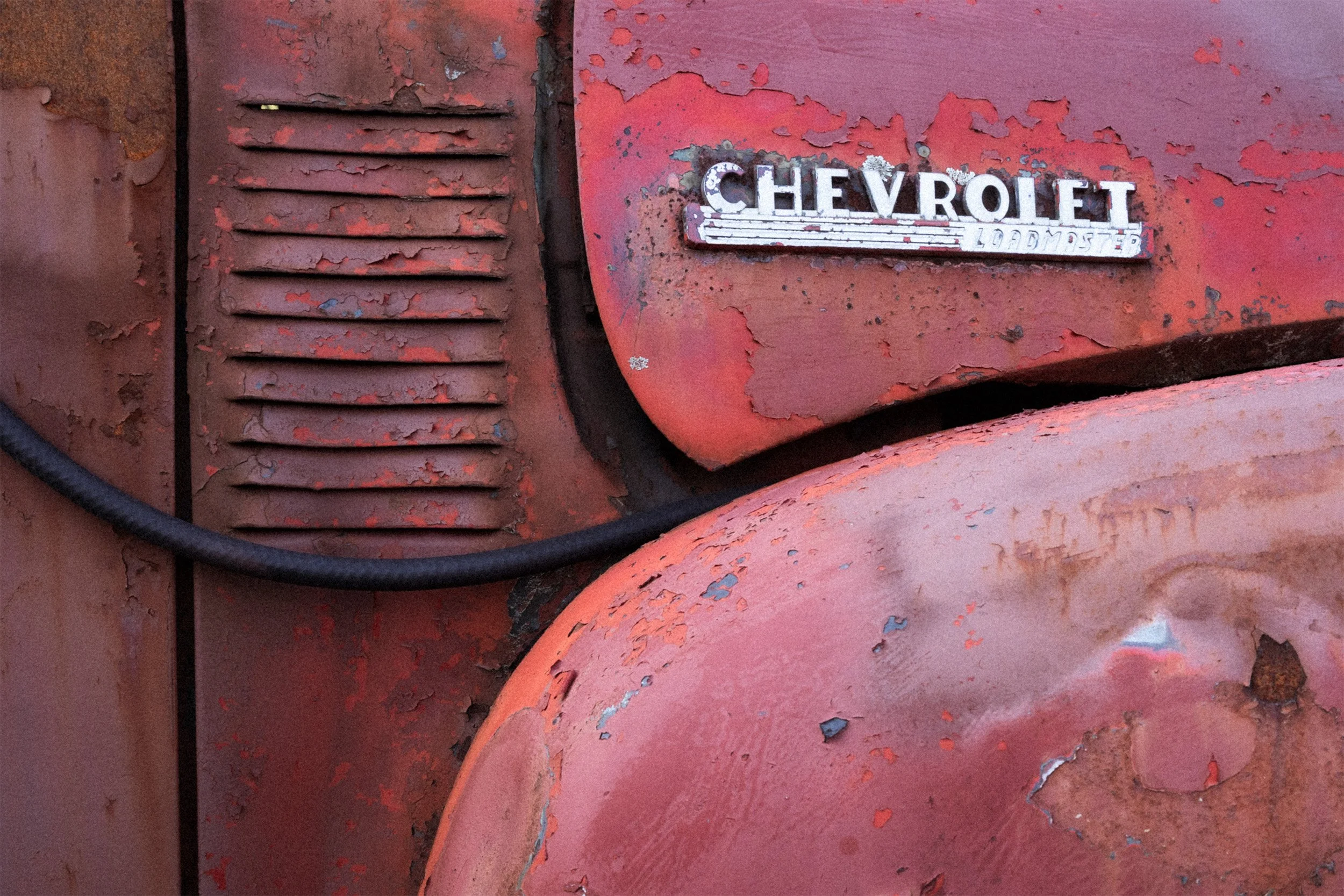 Image of the side door, hood and front fender skirt of a late 1940's, early 1950's Chevy Loadmaster truck