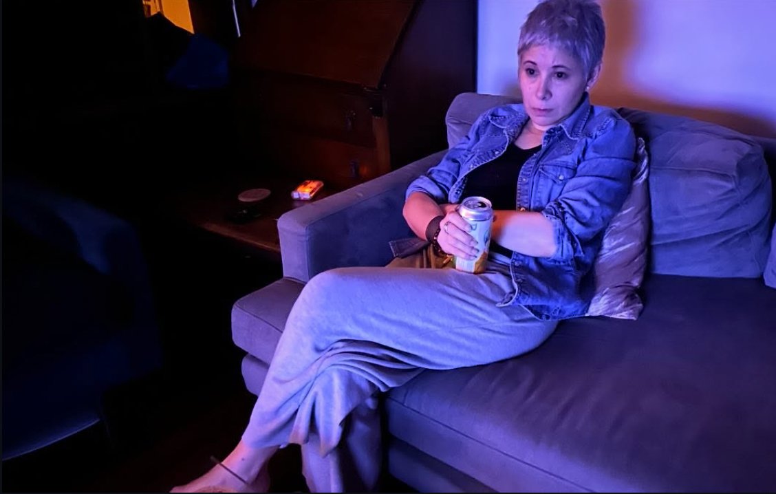 Xena (Gina Jarrin) watching a horror movie while acting in a horror movie.