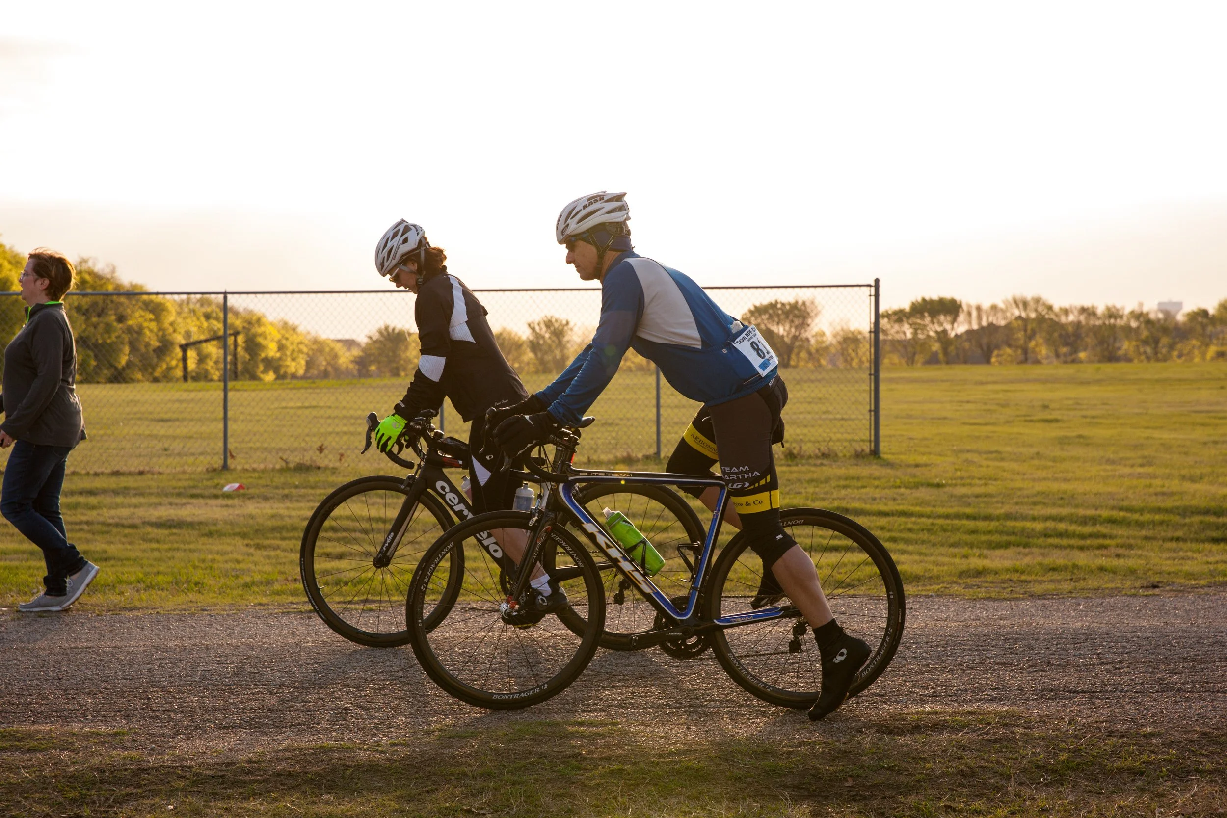Cyclists ride together in early morning light during an outdoor nonprofit fundraising event in the Dallas-Fort Worth area.