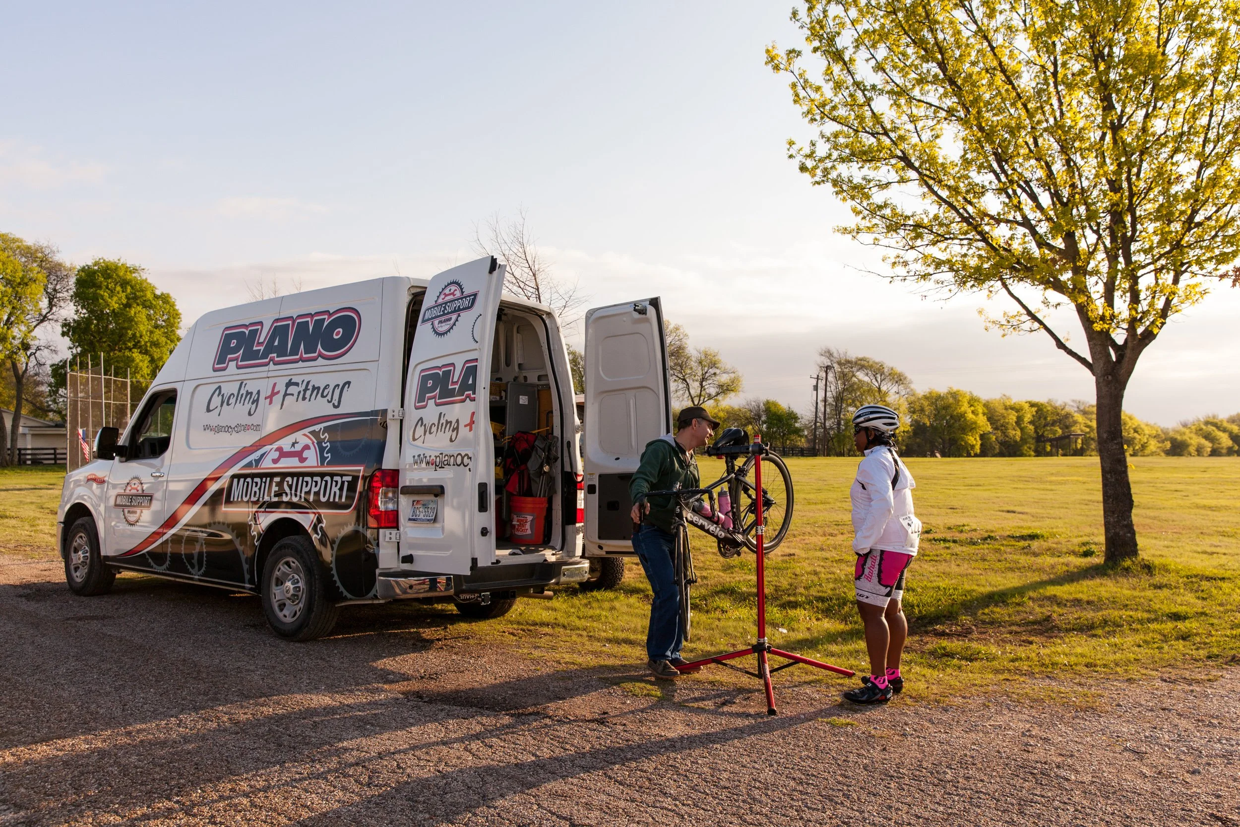 A cycling service van and bikes; event support team provide on-course assistance during a nonprofit fundraising ride.