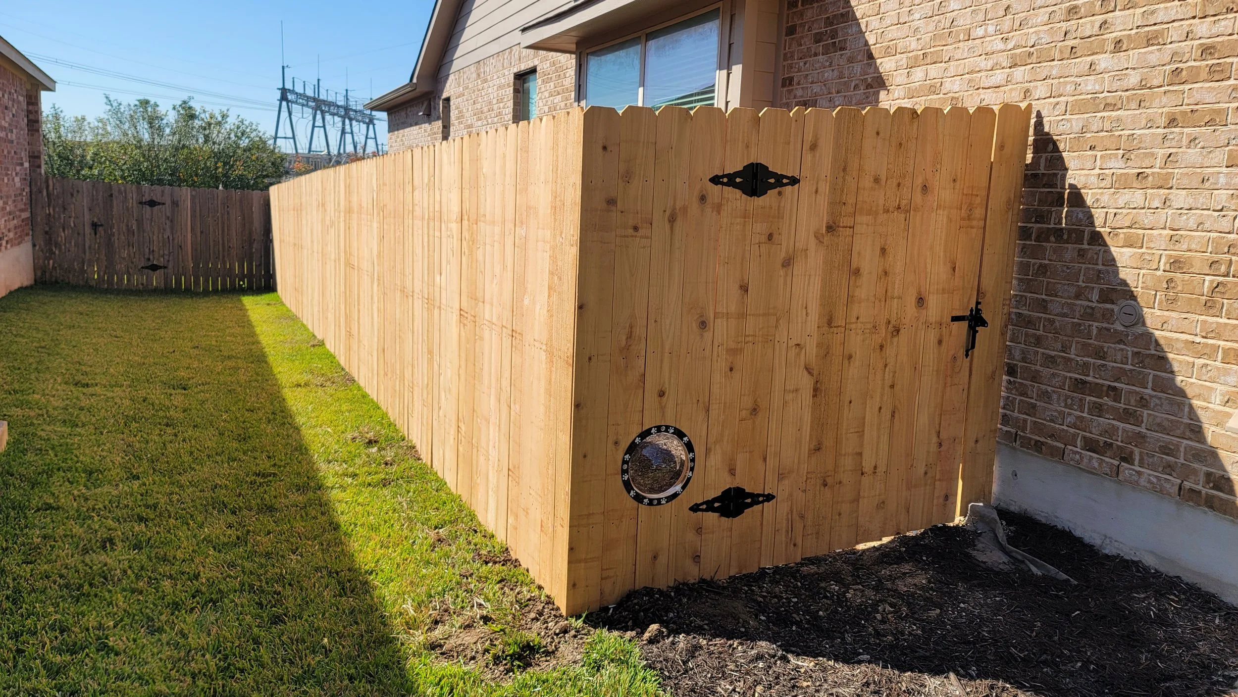 Cedar gate with dog window.jpg