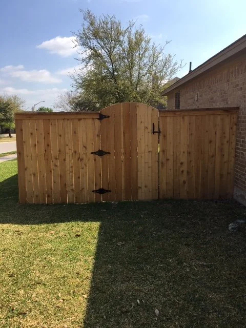 Arched gate with cedar topper.JPG