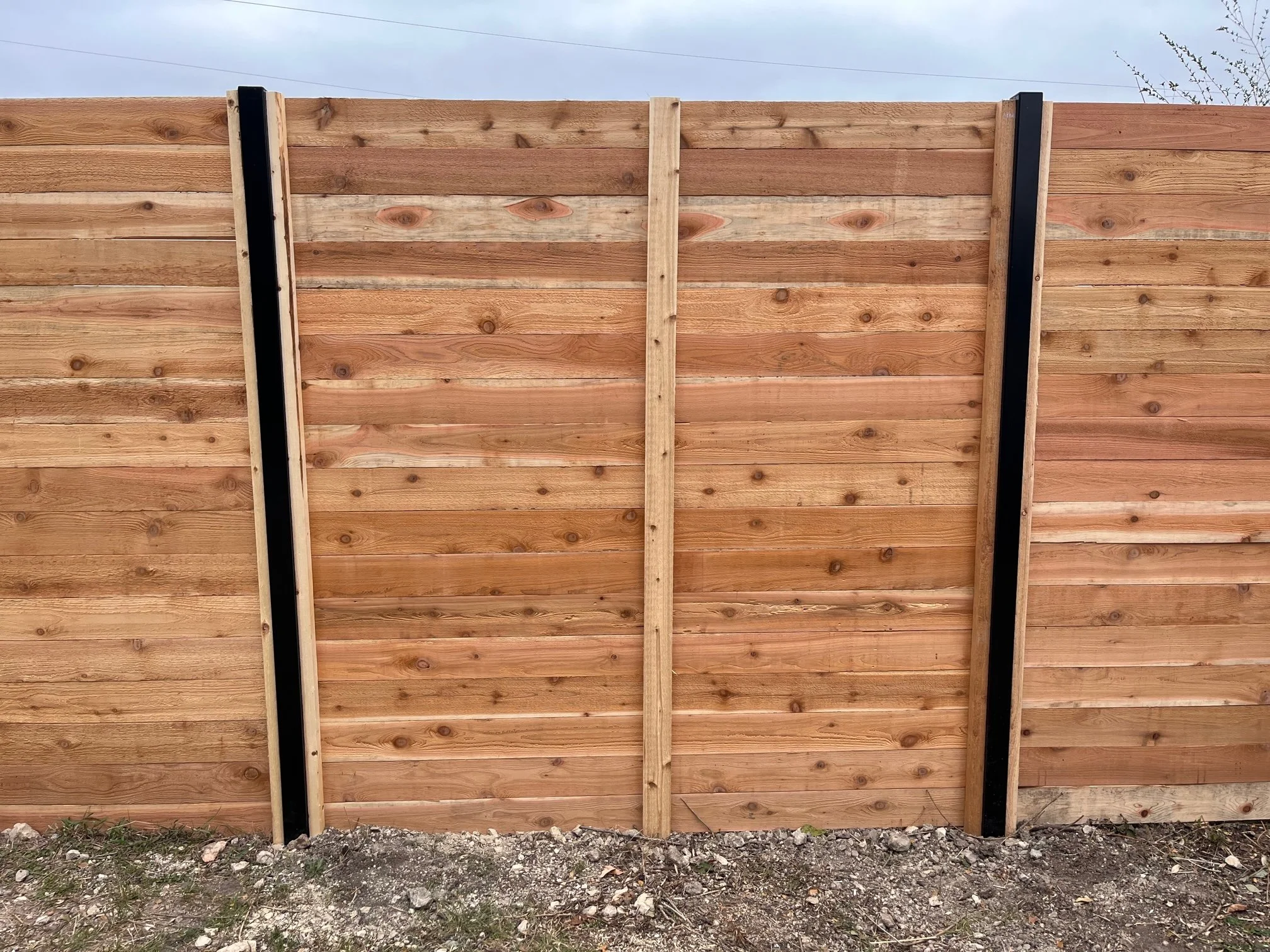back side of 8ft tall horizontal with black posts.jpg