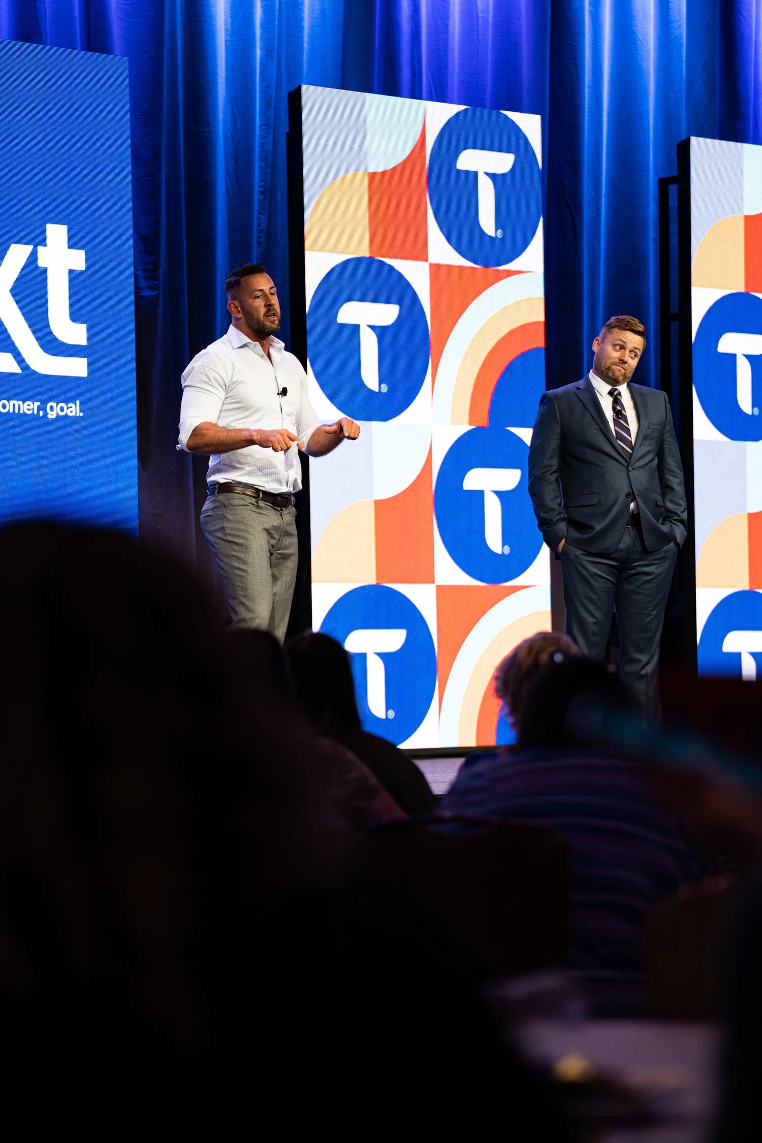 Two speakers on stage at the Truvy Summit 2022 in Atlanta