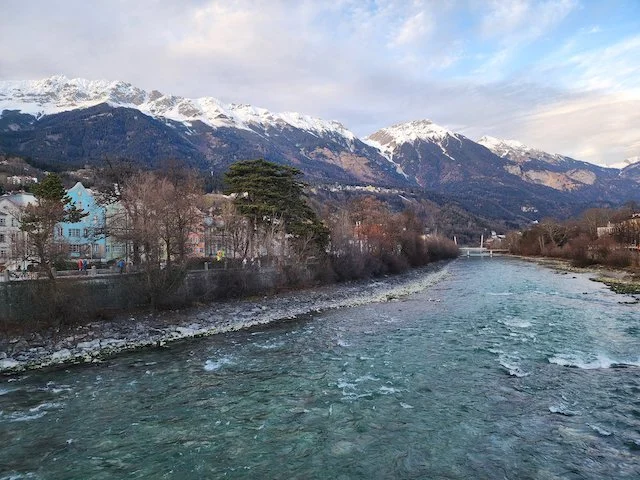 https://images.squarespace-cdn.com/content/v1/631b9bf5cea44122019286d4/0c973411-9de6-42e2-876e-82b58cdcb94d/Innsbruck%2Bbridge%2Bview%2BDe%2Bc2022.jpeg