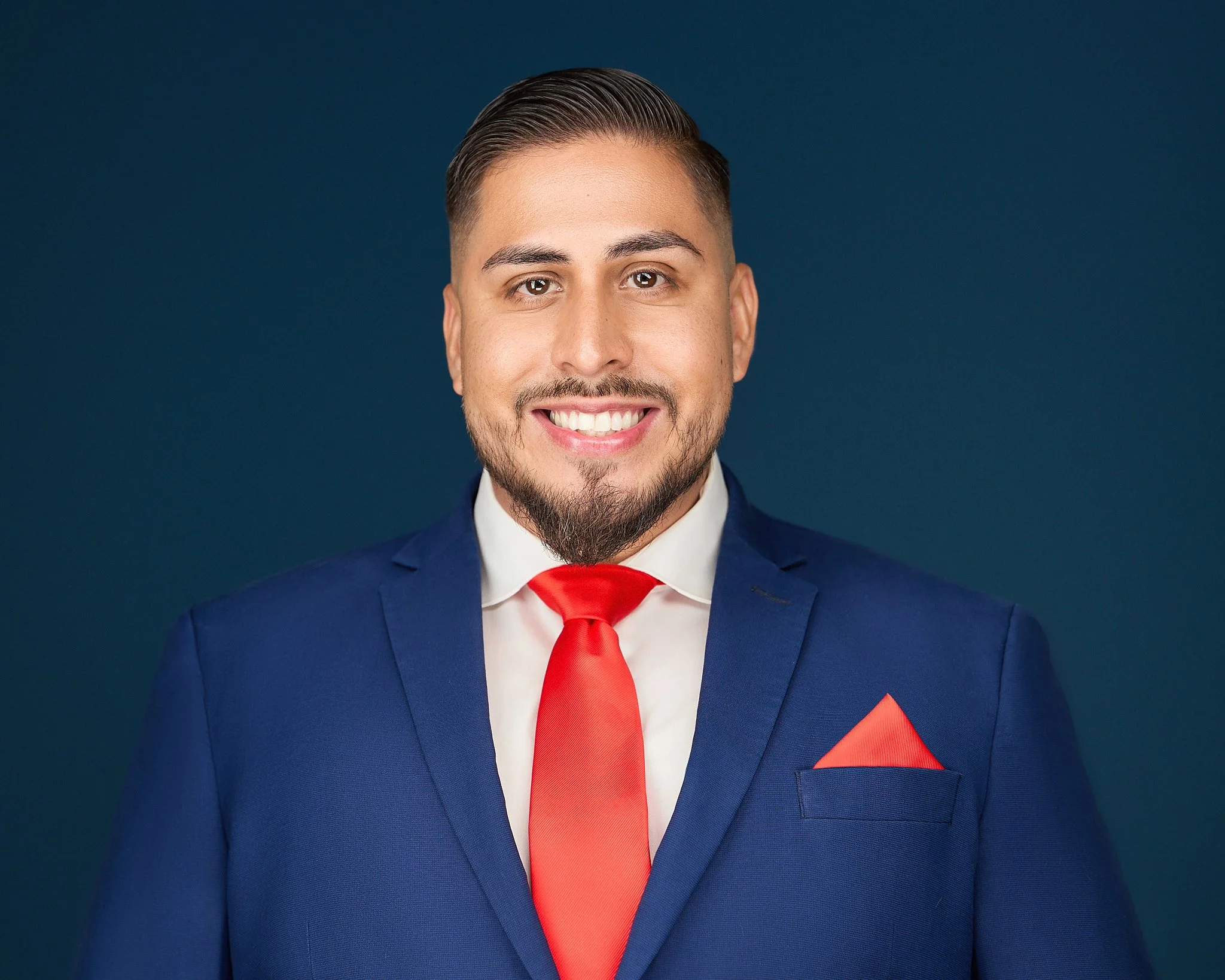 professional headshot on blue background