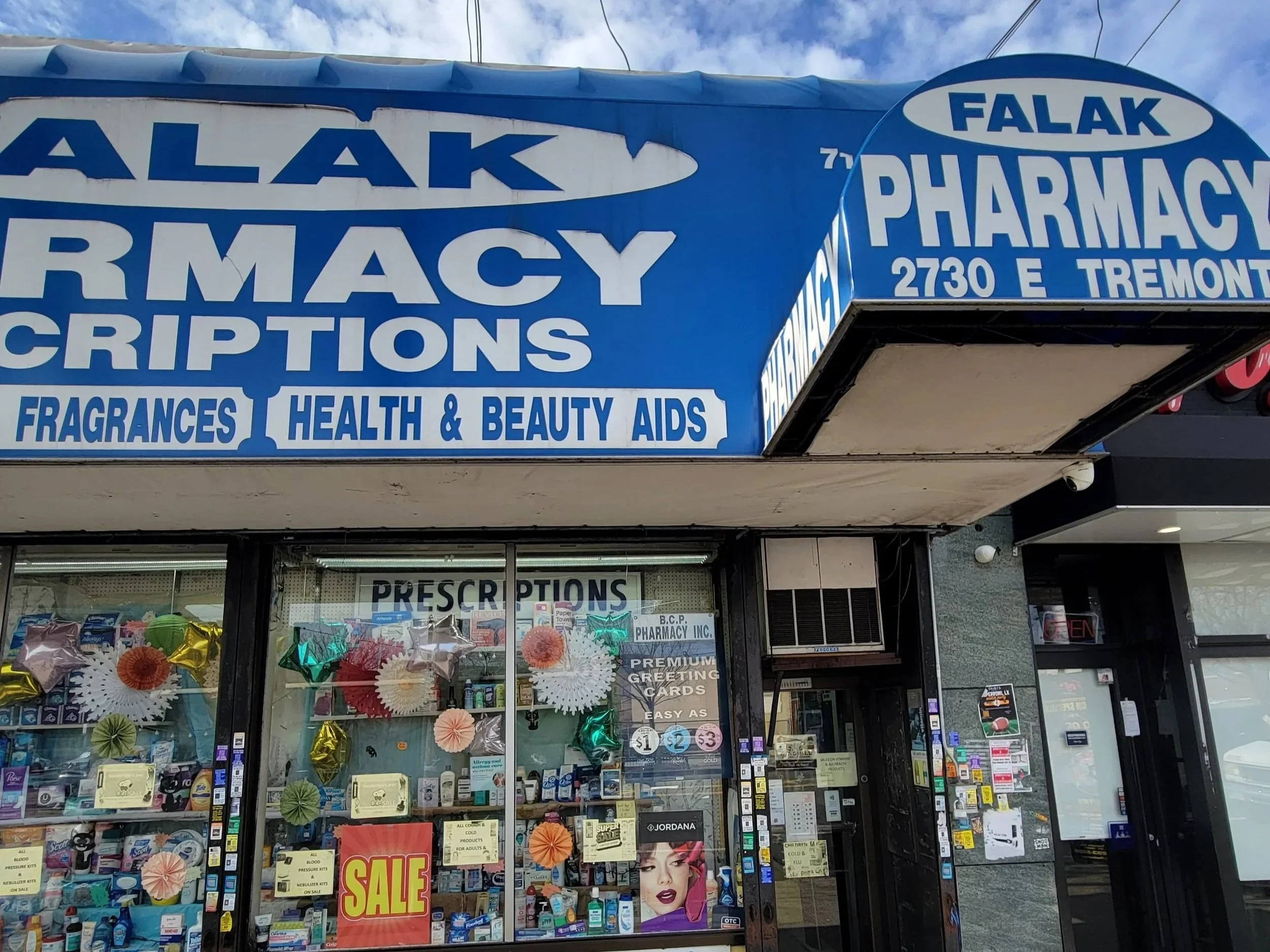 Image of Falak Pharmacy store front in the Bronx, New York