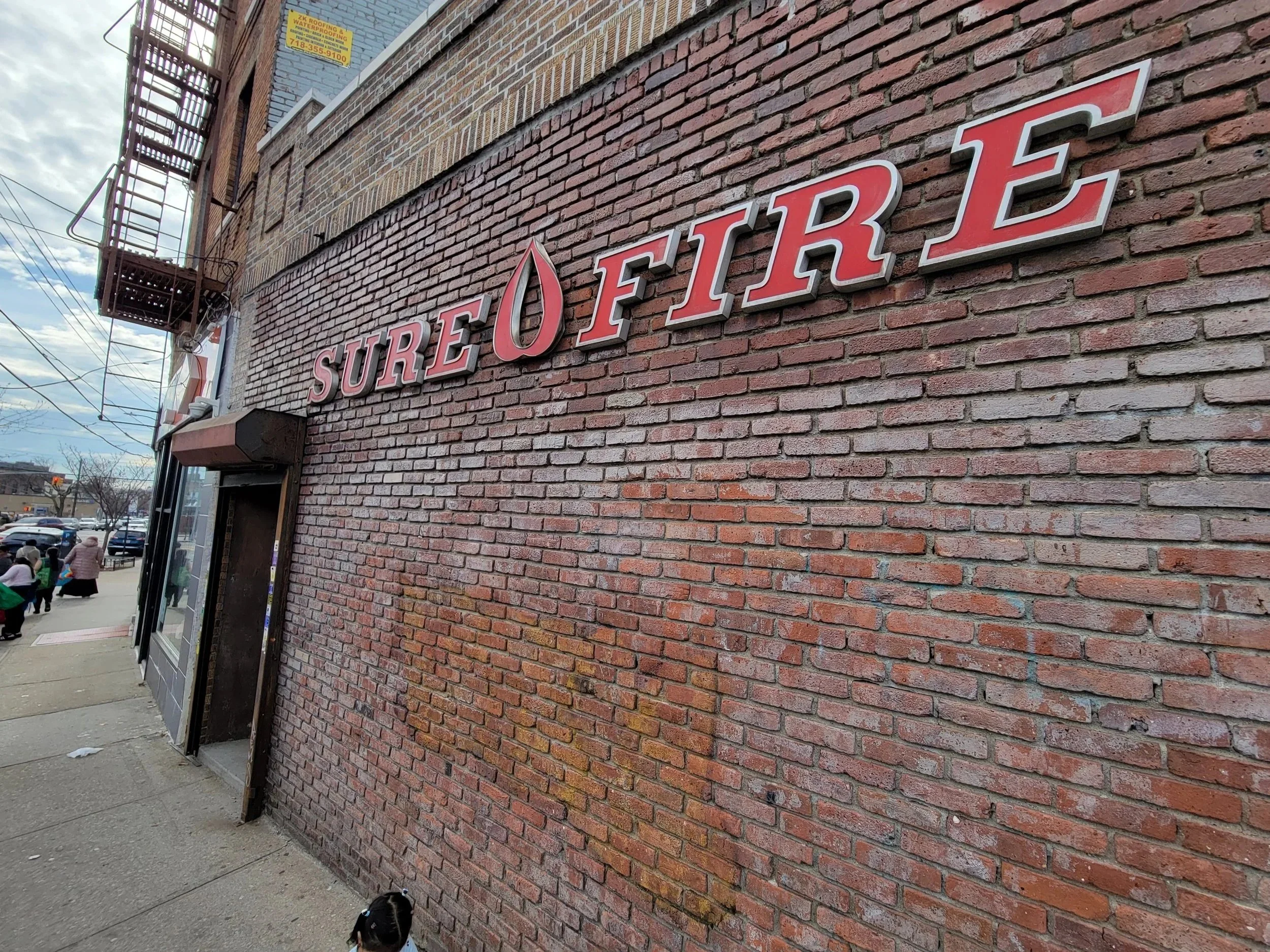 Image of Sure Fire Oil storefront in the Bronx, New York