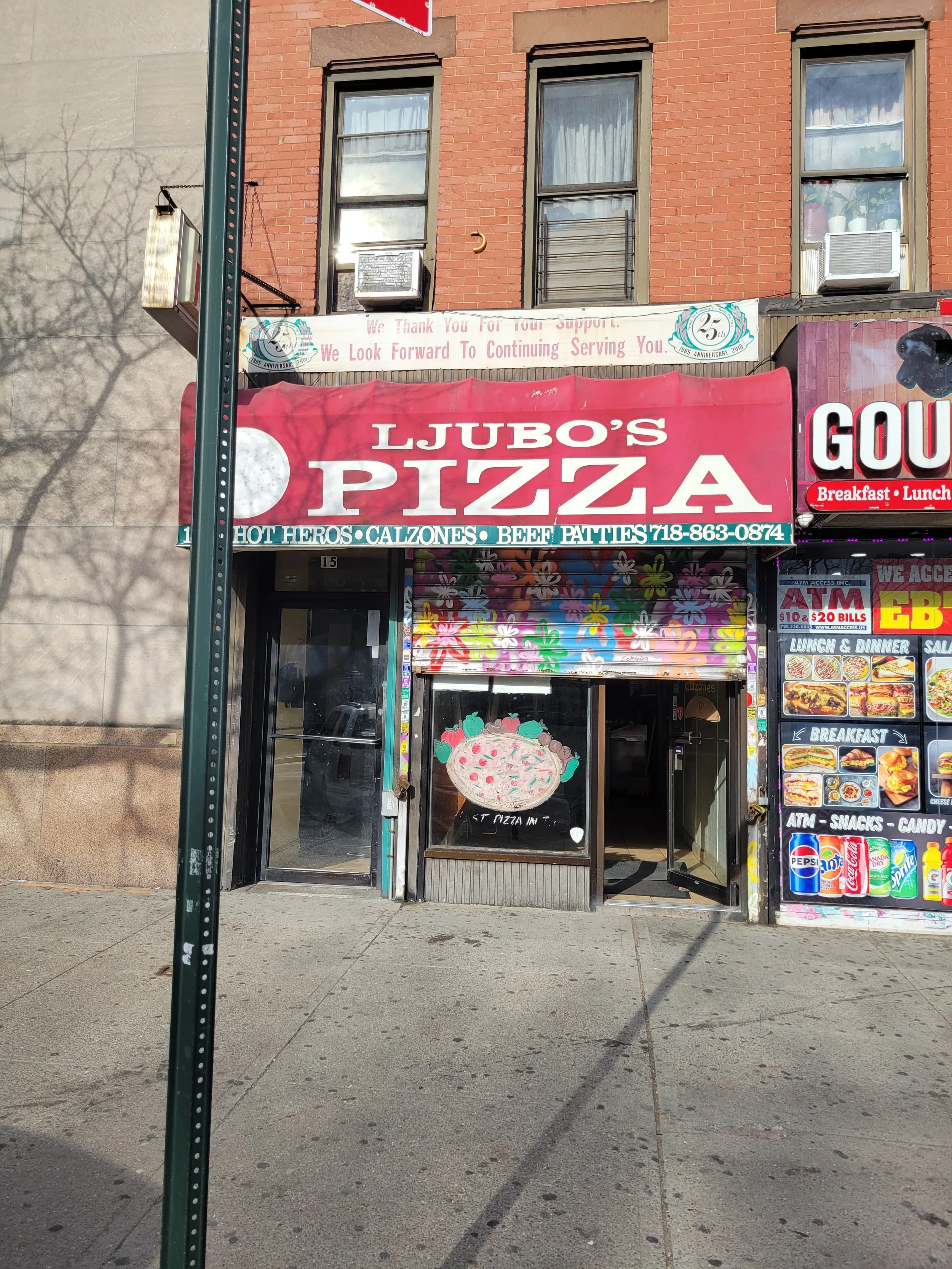 Image of Ljubo's Pizza store front in the Bronx, New York