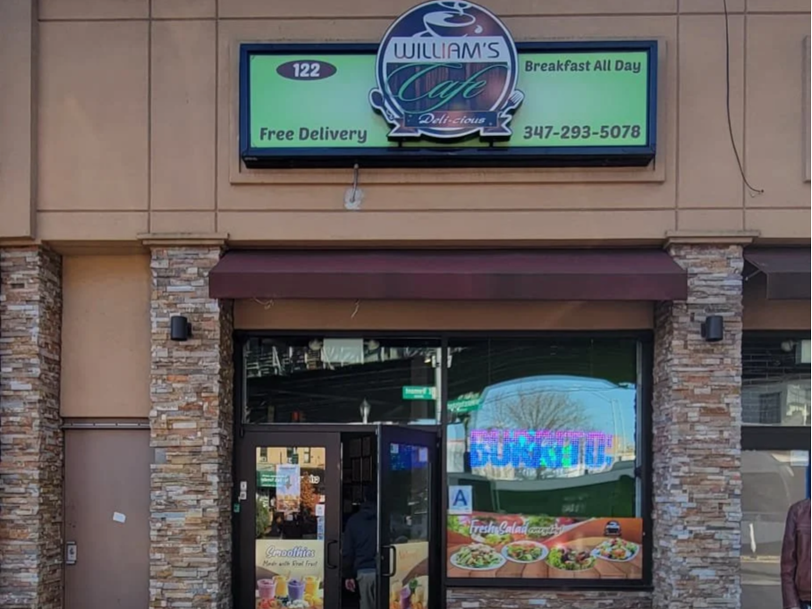Image of William's Cafe Restaurant store front in the Bronx, New York.