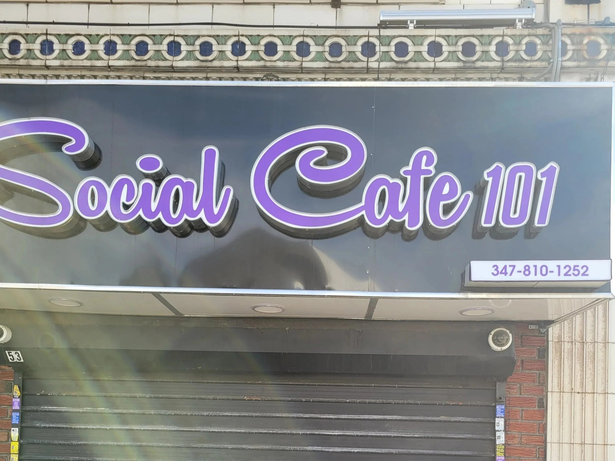 Image of Social Cafe 101 restaurant and bar front entrance in the Bronx, New York