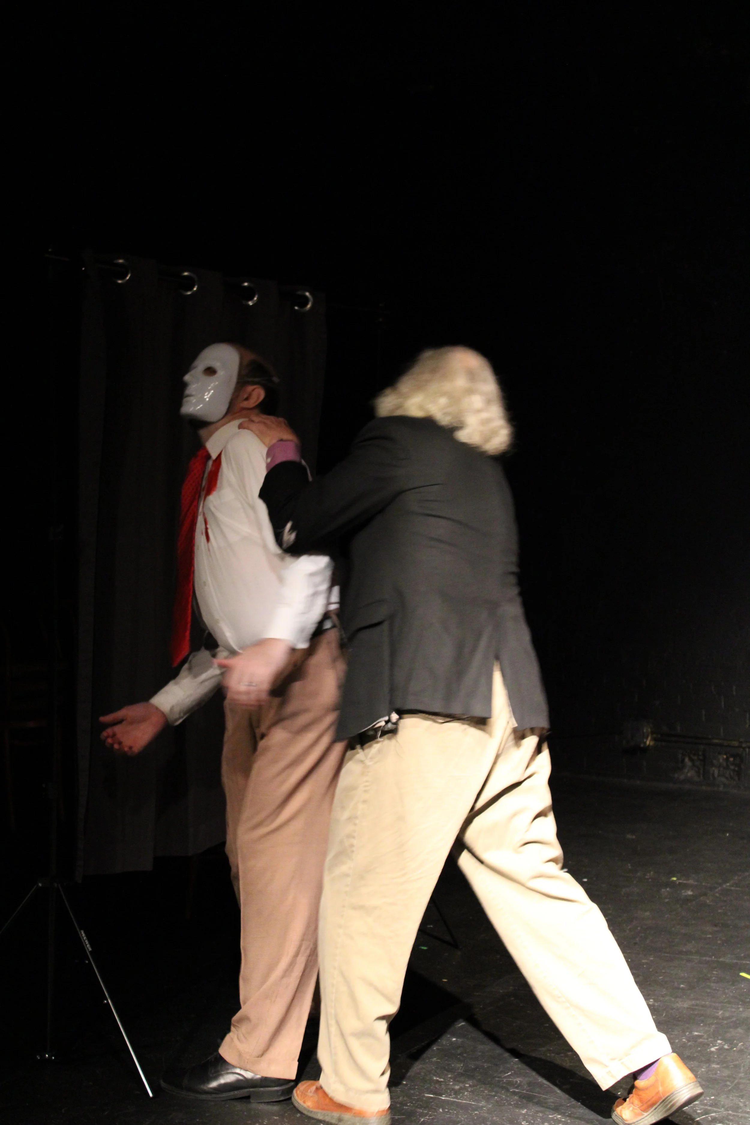 Six (Mark Peters) knifes Bouncer (Clinton Powell).