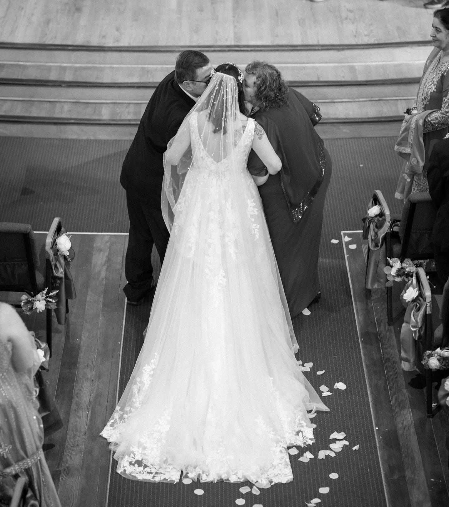 A kiss from Mom and Dad at the end of the isle 🥰
