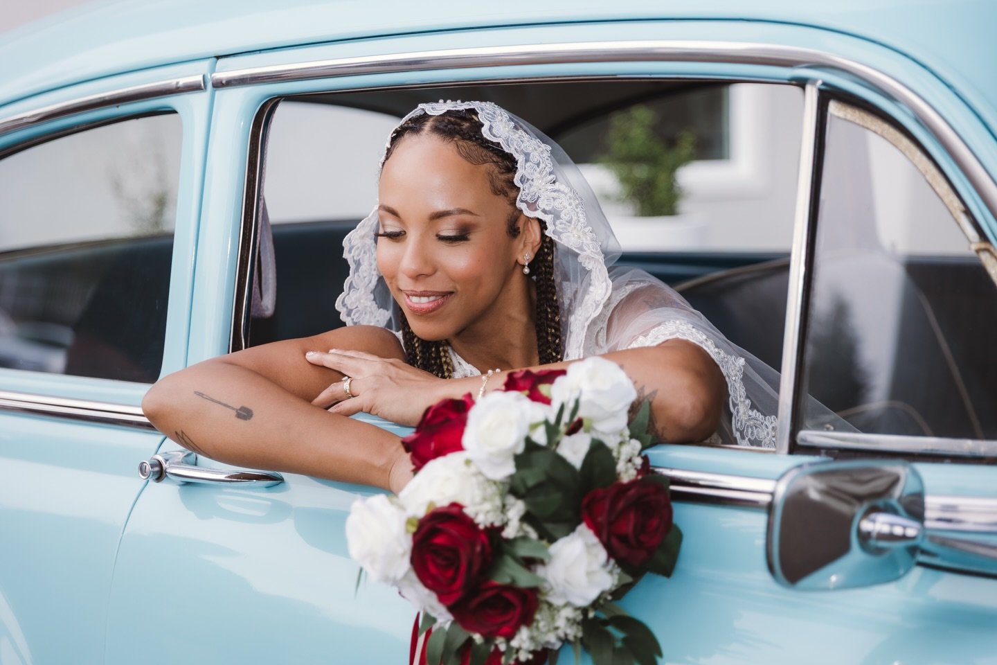 Your portraits don&rsquo;t have to be perfectly posed on a perfectly manicured lawn. Sometimes they&rsquo;re black and white through a windshield. Sometimes they&rsquo;re your bride leaning out a &lsquo;50s car window with roses in hand. Sometimes th
