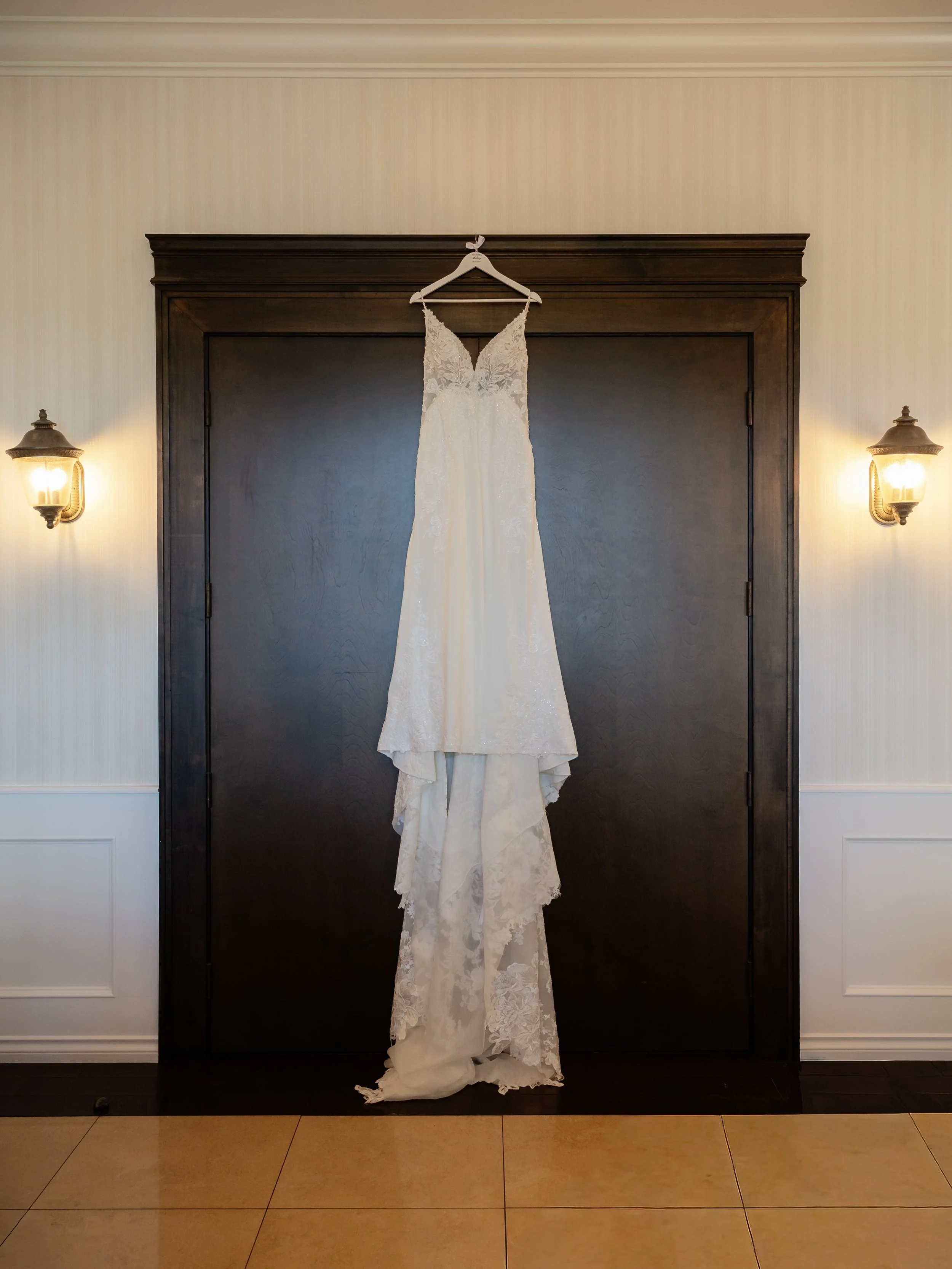 Do we use AI to edit? Yes, sometimes we do.

Here&rsquo;s a before and after of my bride&rsquo;s wedding dress. I loved the idea of hanging the dress on these big doors, except that was also where the buffet was being set up.

My editing is the same 
