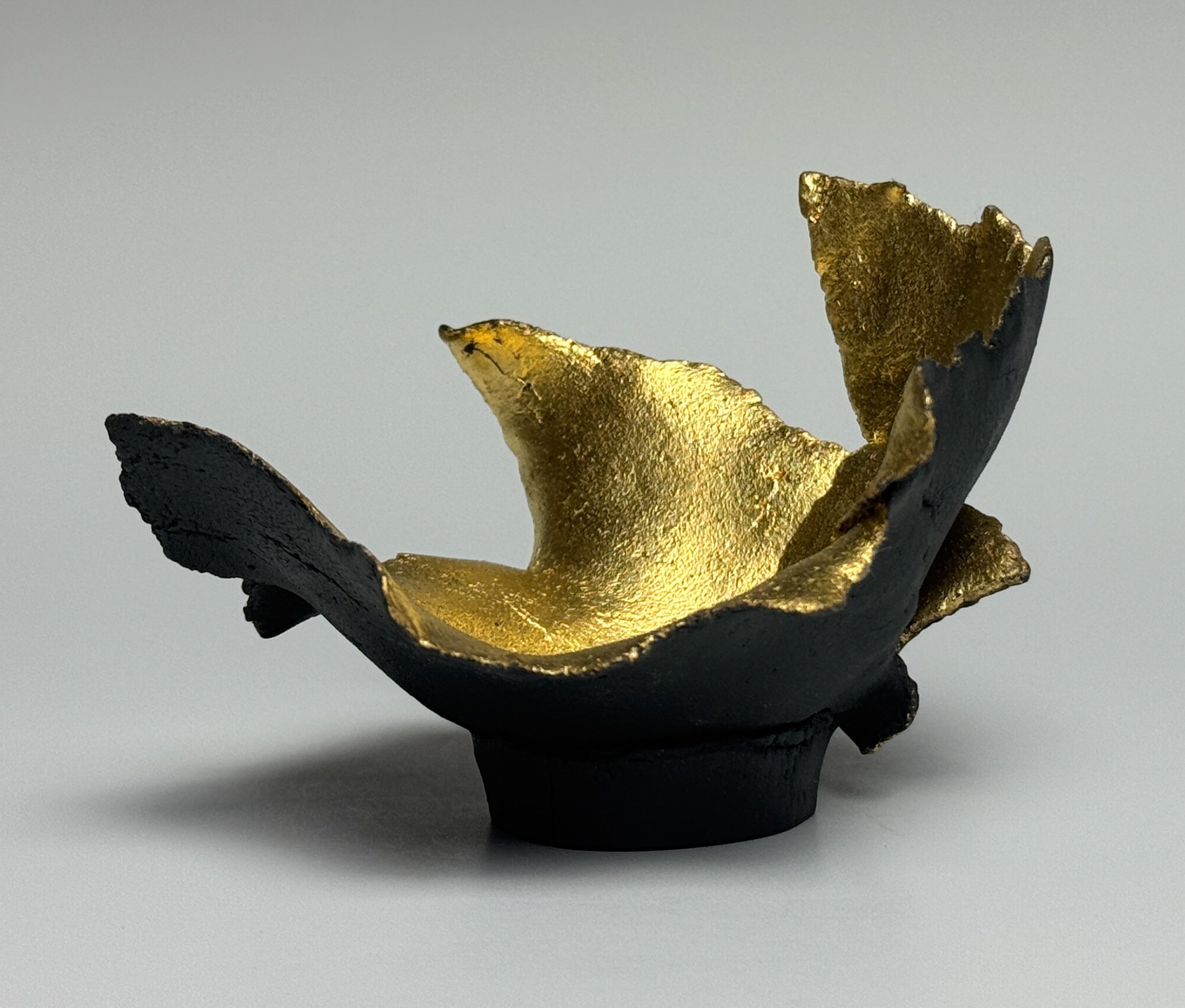 Love Unexplained, Small works series
3" H x 4.5" x 4.5" 	Custom Black Porcelain, 23.75K Gold Leaf, Cone 6, Oxidation