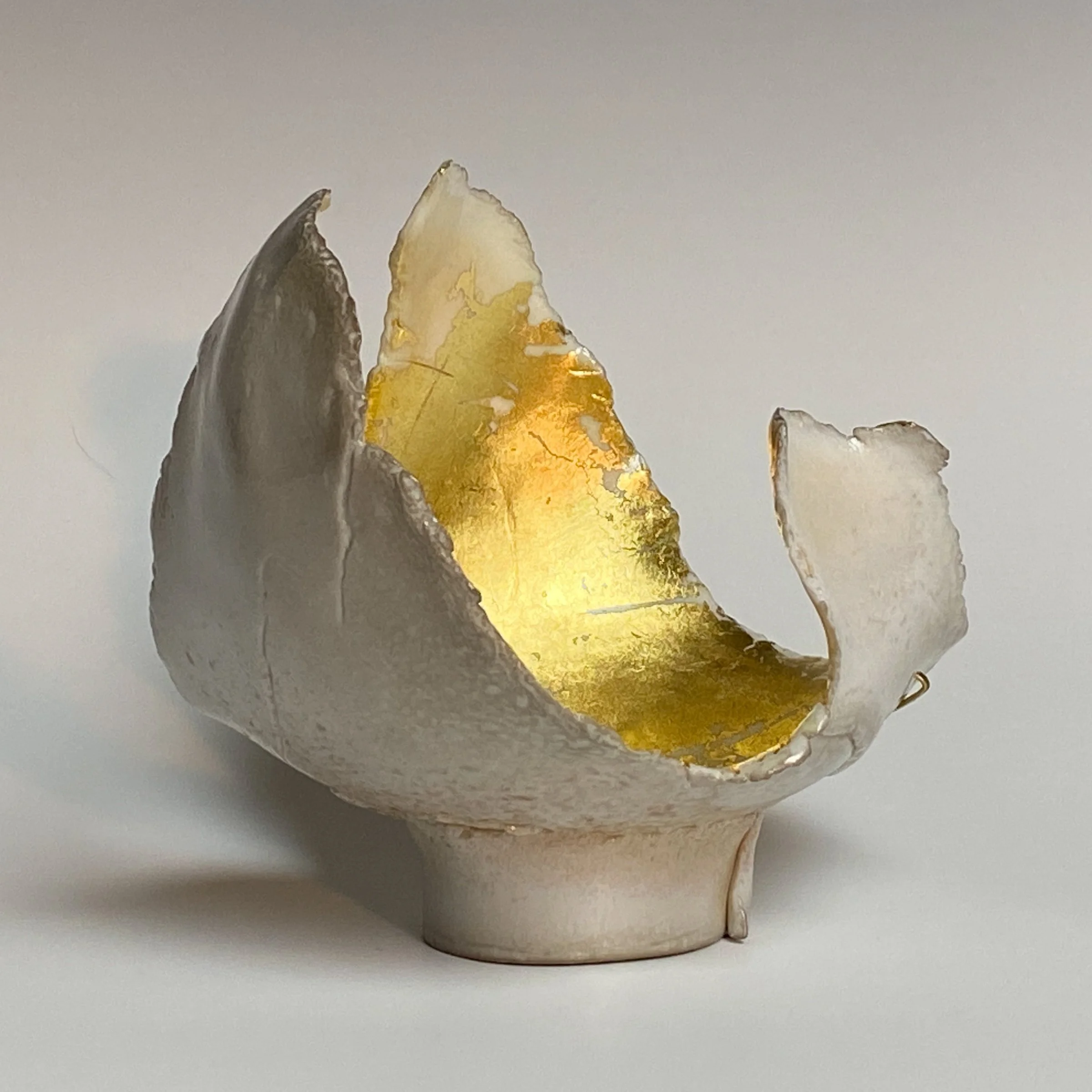 Uplifting, Shepherd Series #7
Porcelain, Soda/Ash Glaze, 23.5 L gold leaf, Hand Hammered Brass Wire
3.75" H x 5" x 4" 