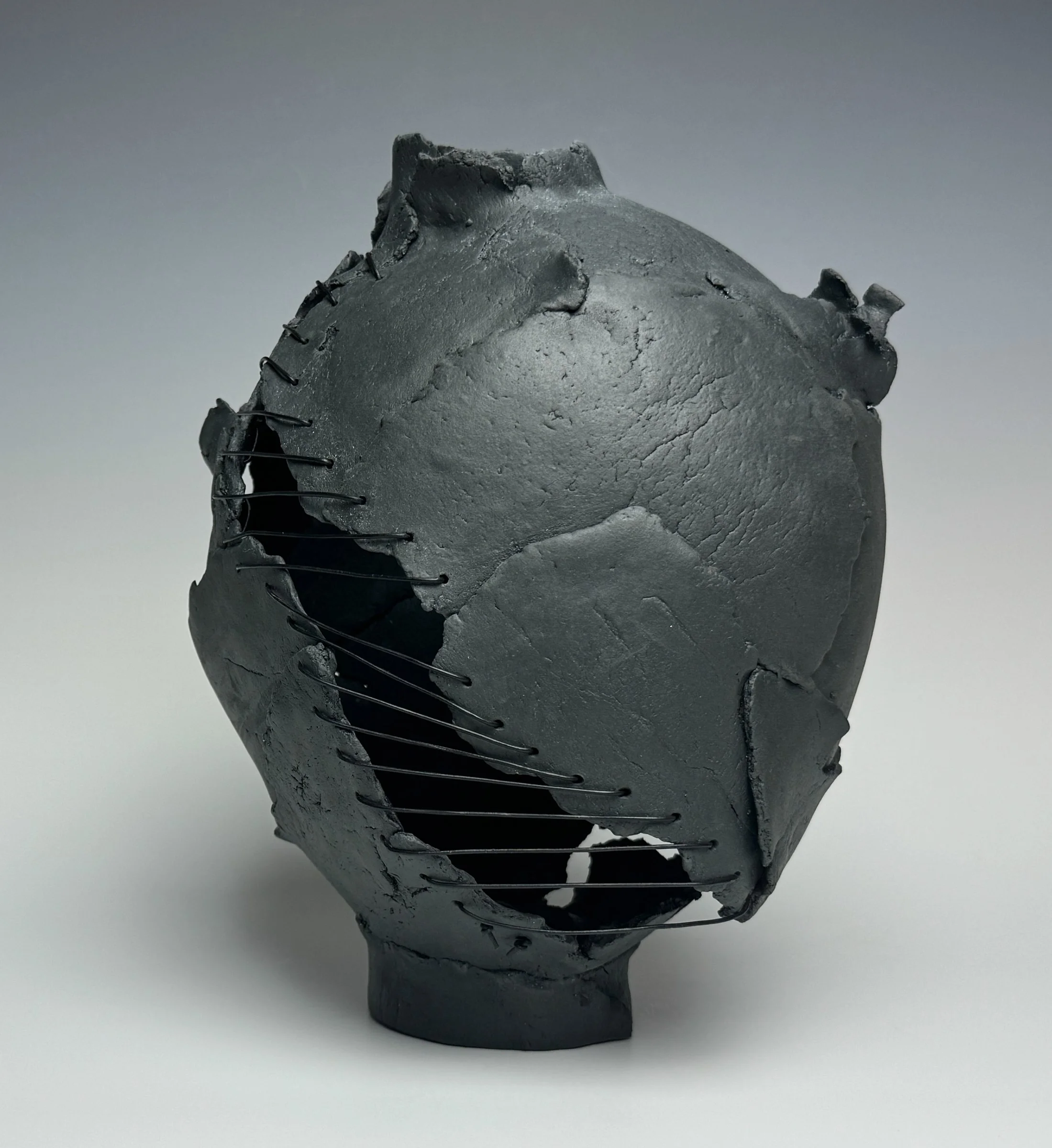 Undaunted
11"H x 9" x 8"
Custom Black Porcelain, Leather Cord