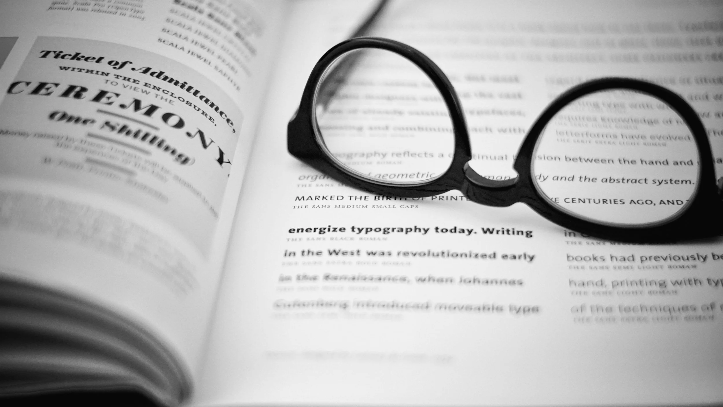 Open book with glasses representing thorough clinical assessment for legal and court psychological reports