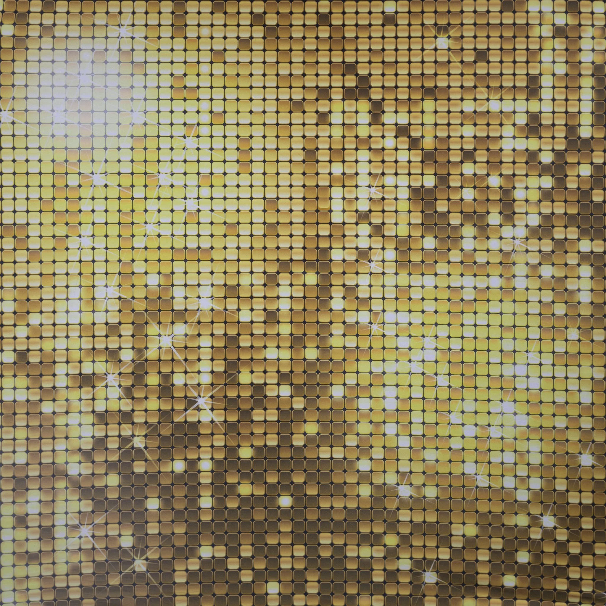 Close-up of a sparkling, gold, sequined surface with reflective star-shaped accents.