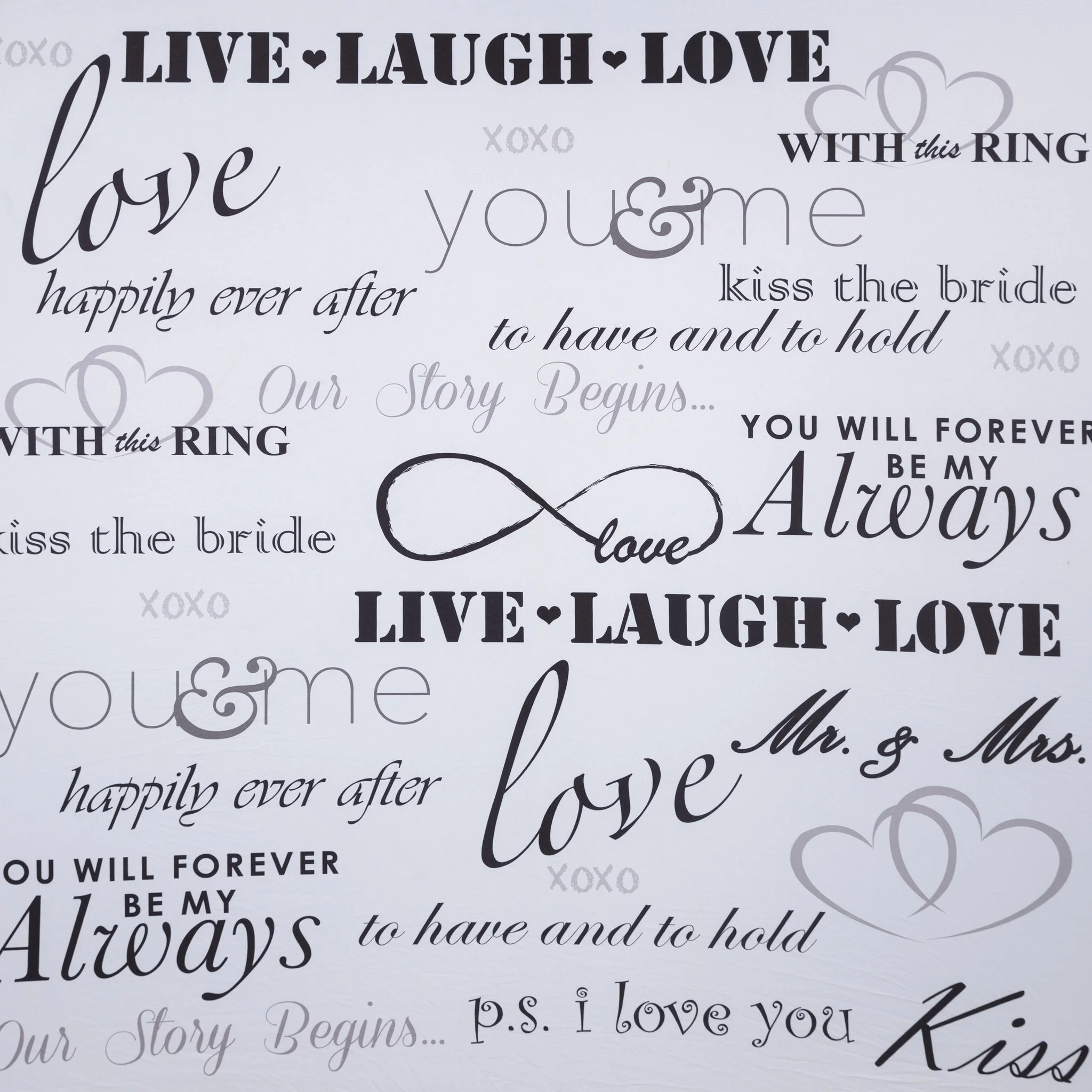 Wedding-themed wall art with phrases such as "Live Laugh Love," "love," "happily ever after," "you & me," "kiss the bride," and "Mr. & Mrs." in various fonts, along with heart and infinity symbols.