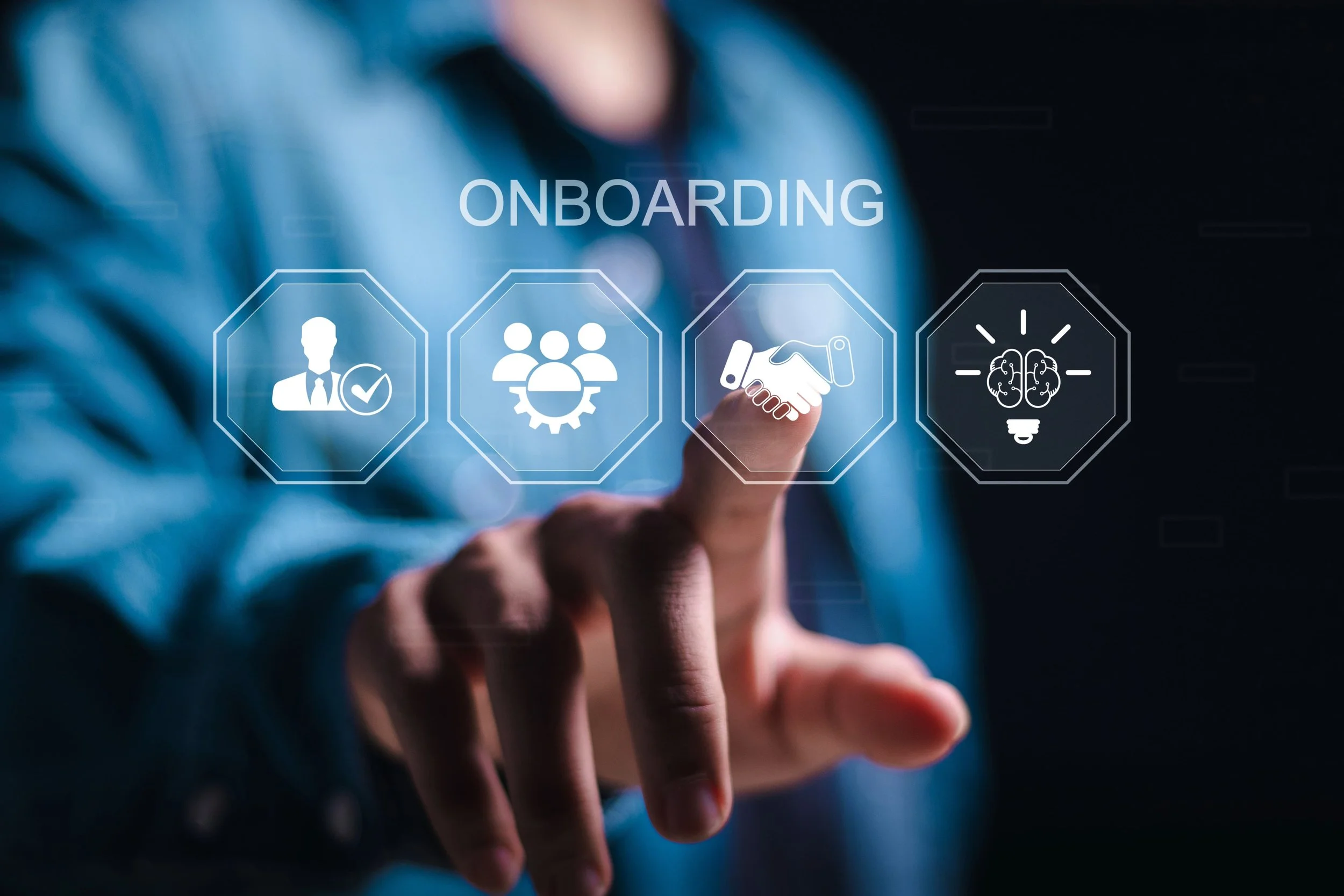 Hand interacting with digital onboarding interface including icons for verification, teamwork, handshake, and insights