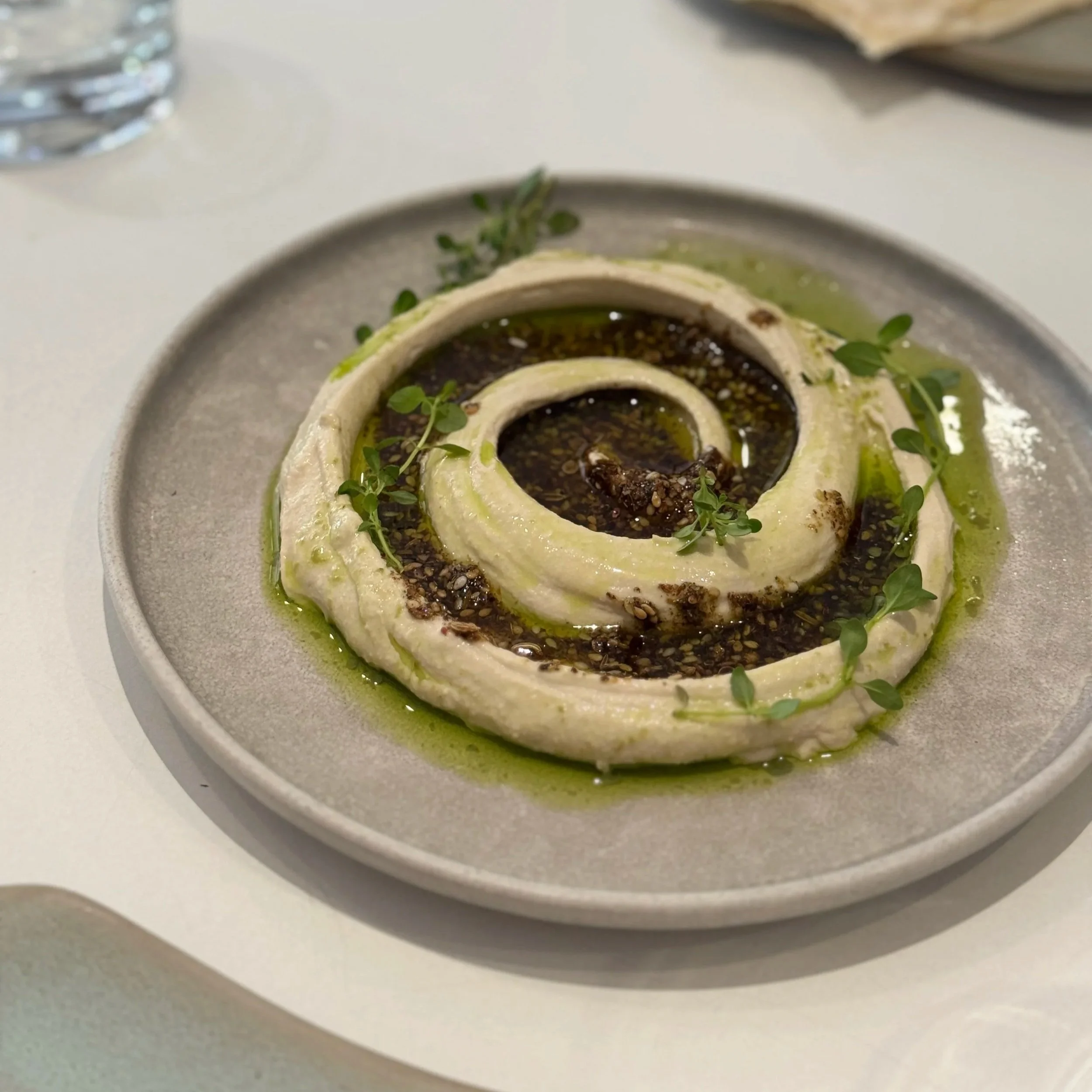 Hummus with za’atar, extra virgin olive oil + dukka at KUBRI restaurant in Paris