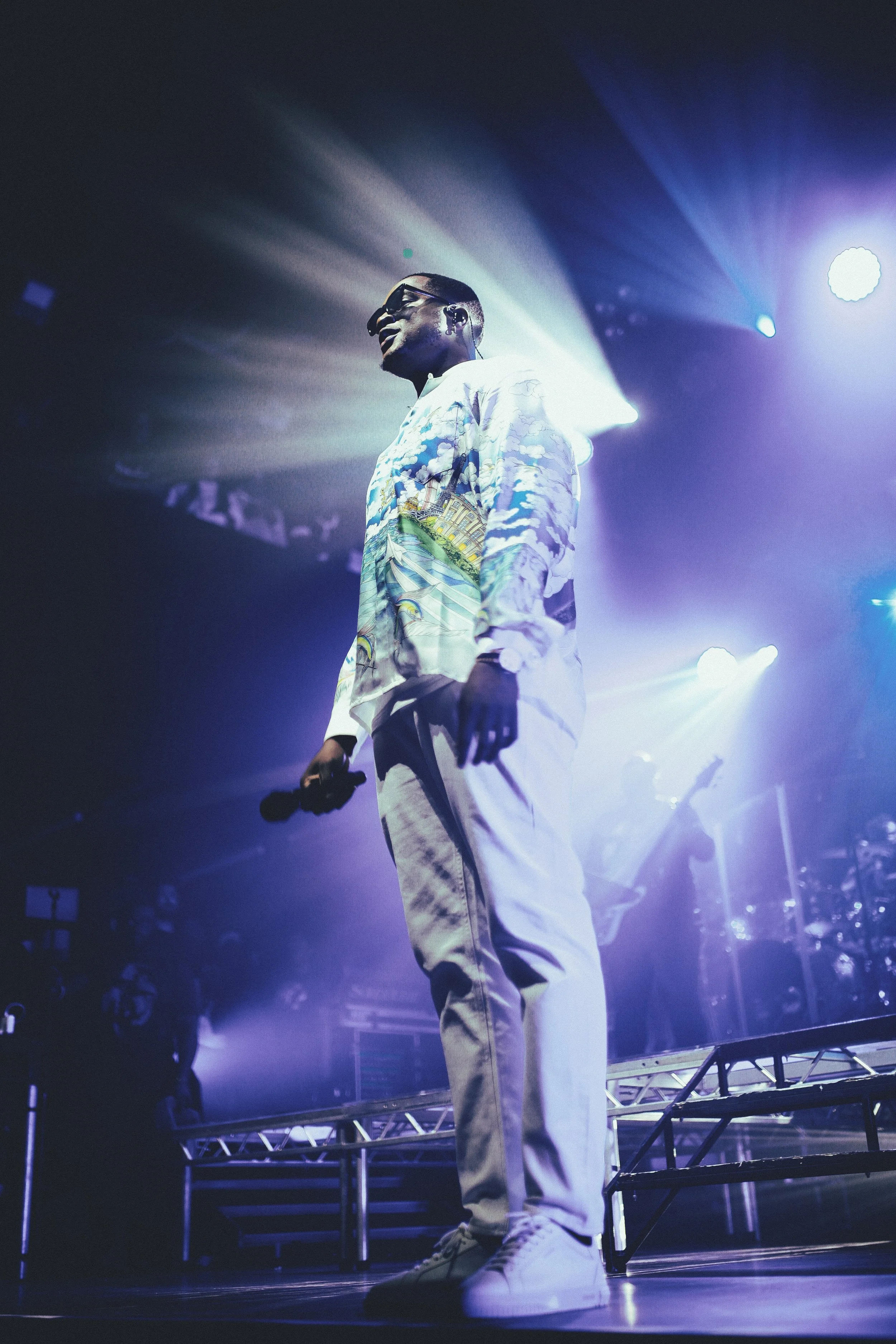 Gabzy wearing a Casa Blanca shirt, white trousers and white Axel Arigato trainers at The Gabzy Experience Concert