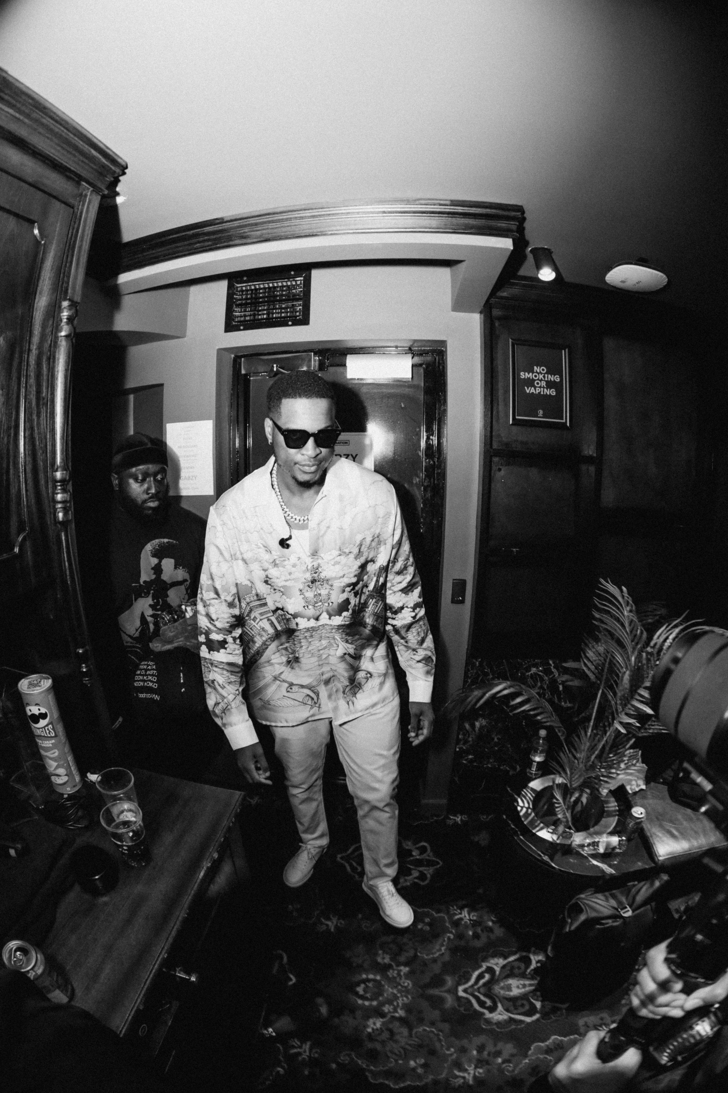Gabzy wearing a Casa Blanca shirt, white trousers and white Axel Arigato trainers at The Gabzy Experience Concert