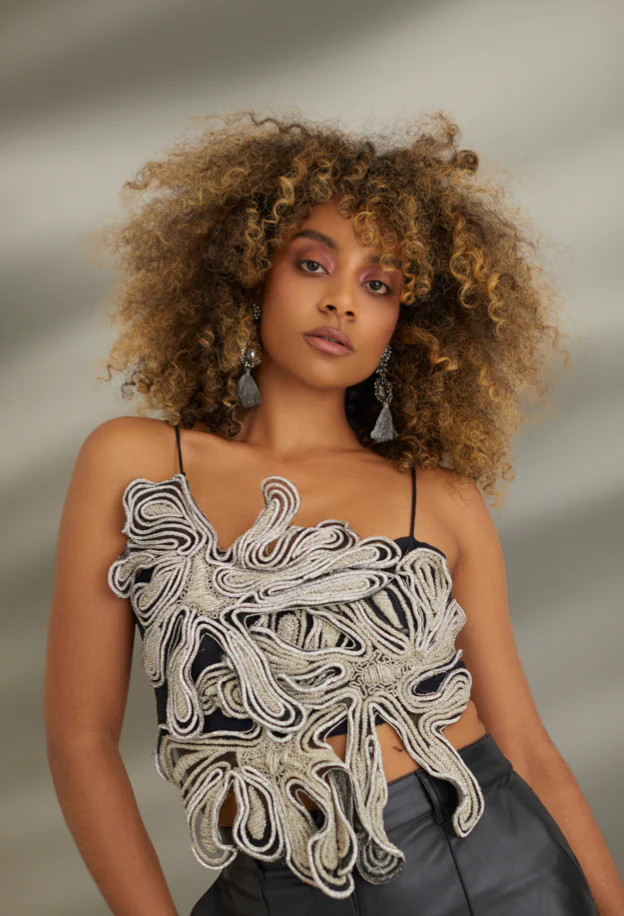 Close up of model wearing Onalaja top