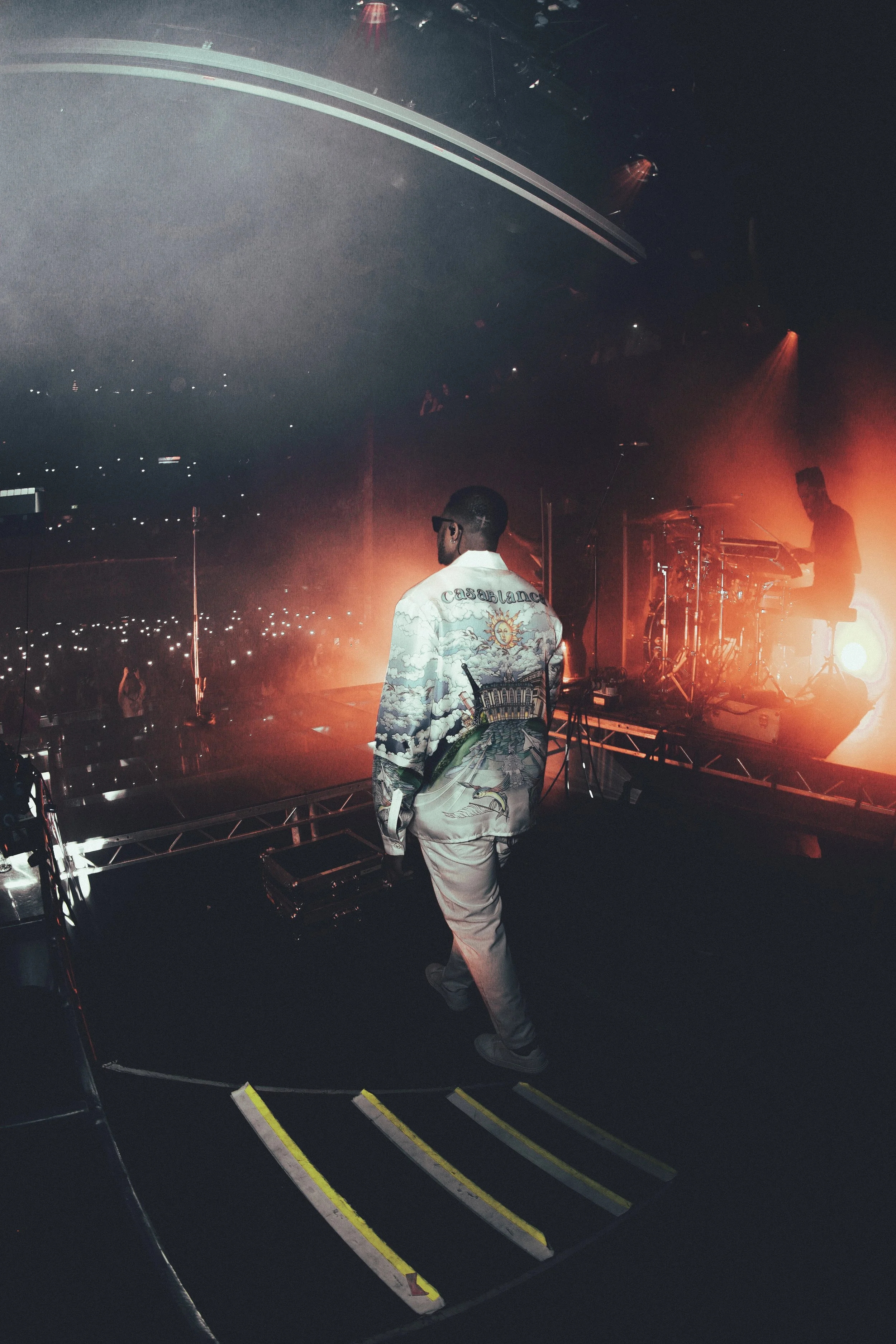 Gabzy wearing a Casa Blanca shirt, white trousers and white Axel Arigato trainers at The Gabzy Experience Concert