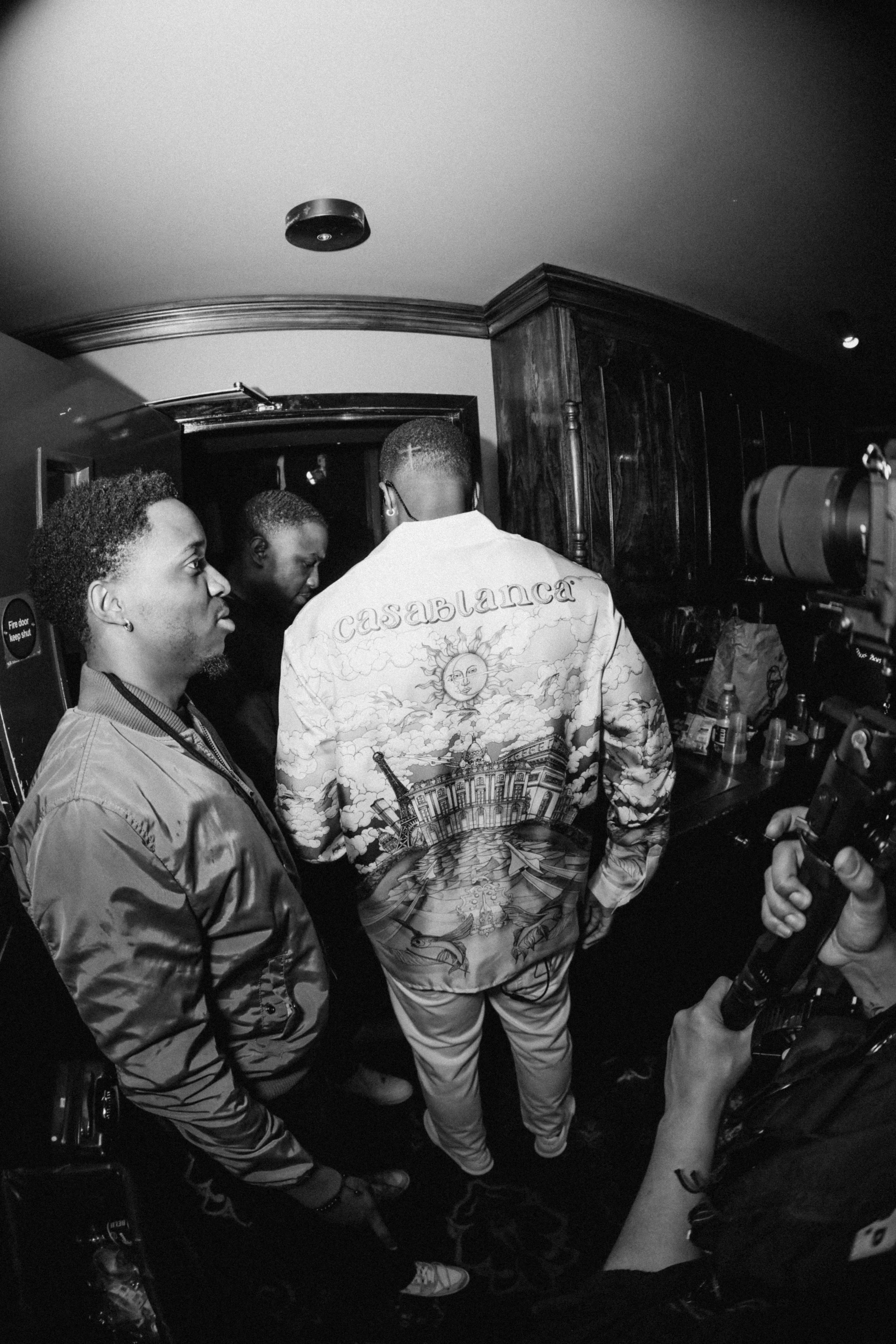 Gabzy wearing a Casa Blanca shirt, white trousers and white Axel Arigato trainers at The Gabzy Experience Concert