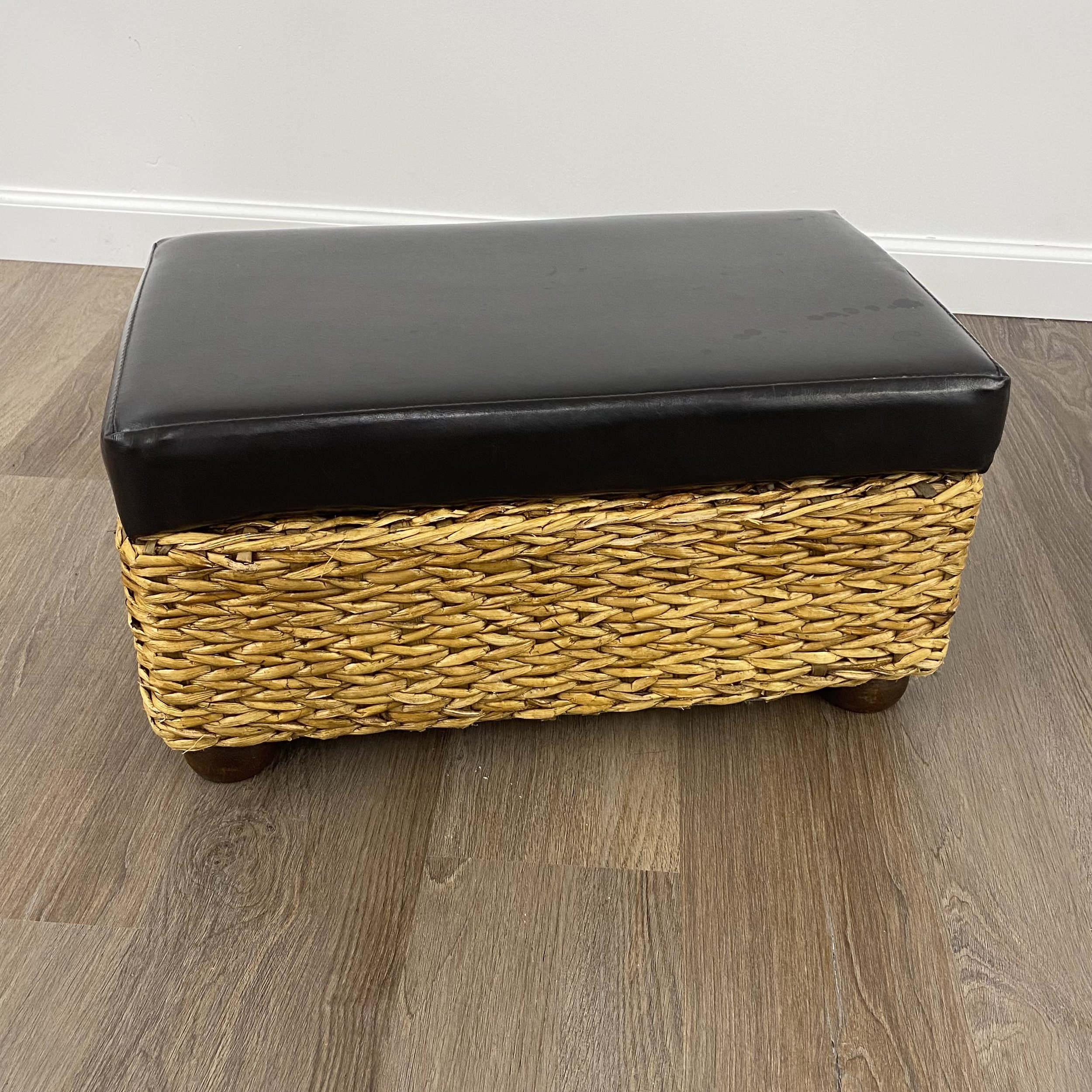 $15. Small foot stool with storage space. (Lid flips up.) Has a few very minor imperfections. Top is a deep brown leather-type material. 12" W x 20.5" L x 10.5" tall.