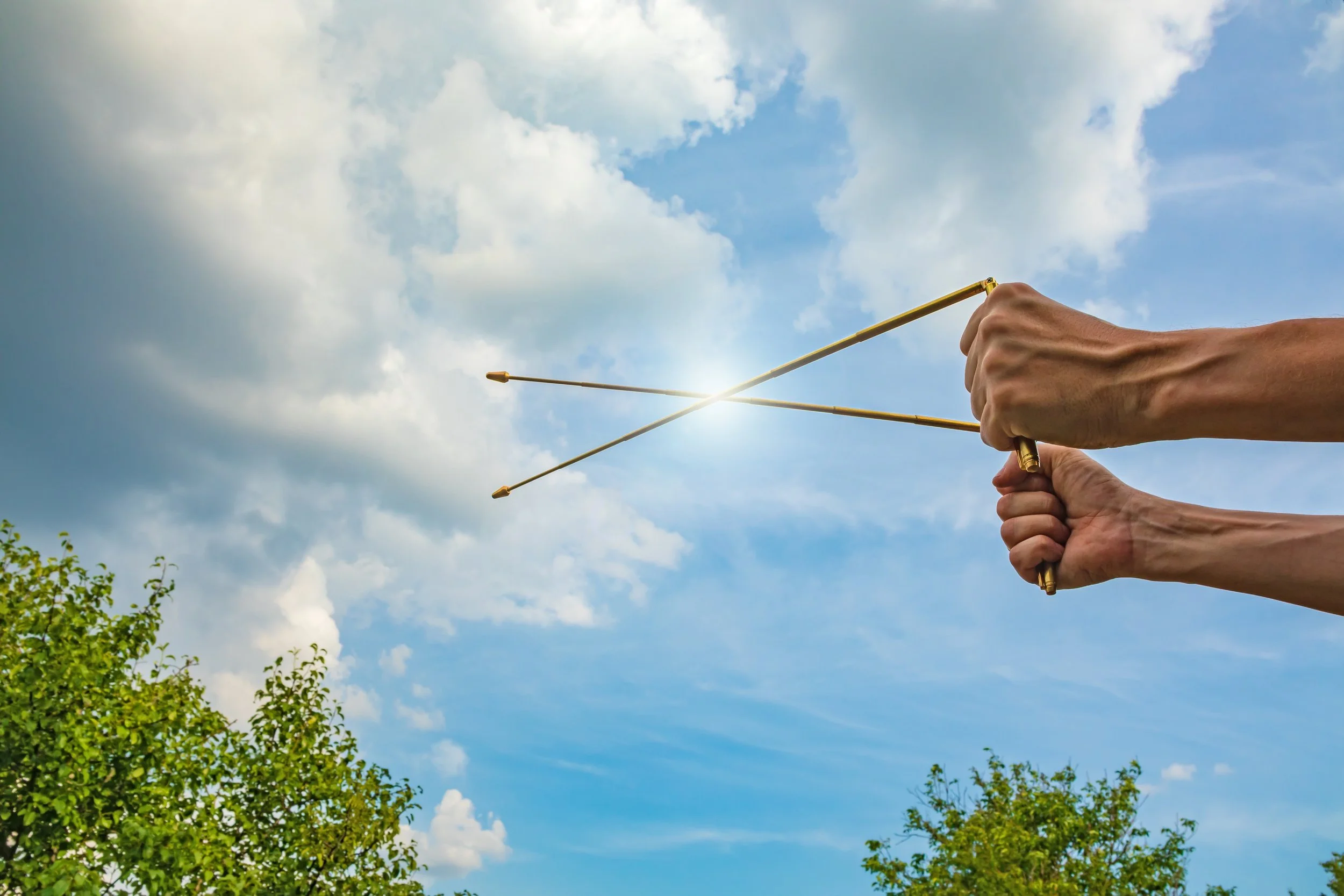 Man using dowsing rods