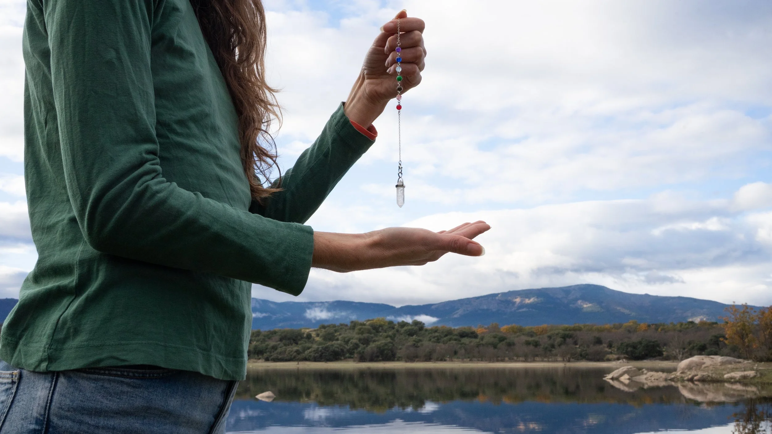Woman dowsing with pendulum
