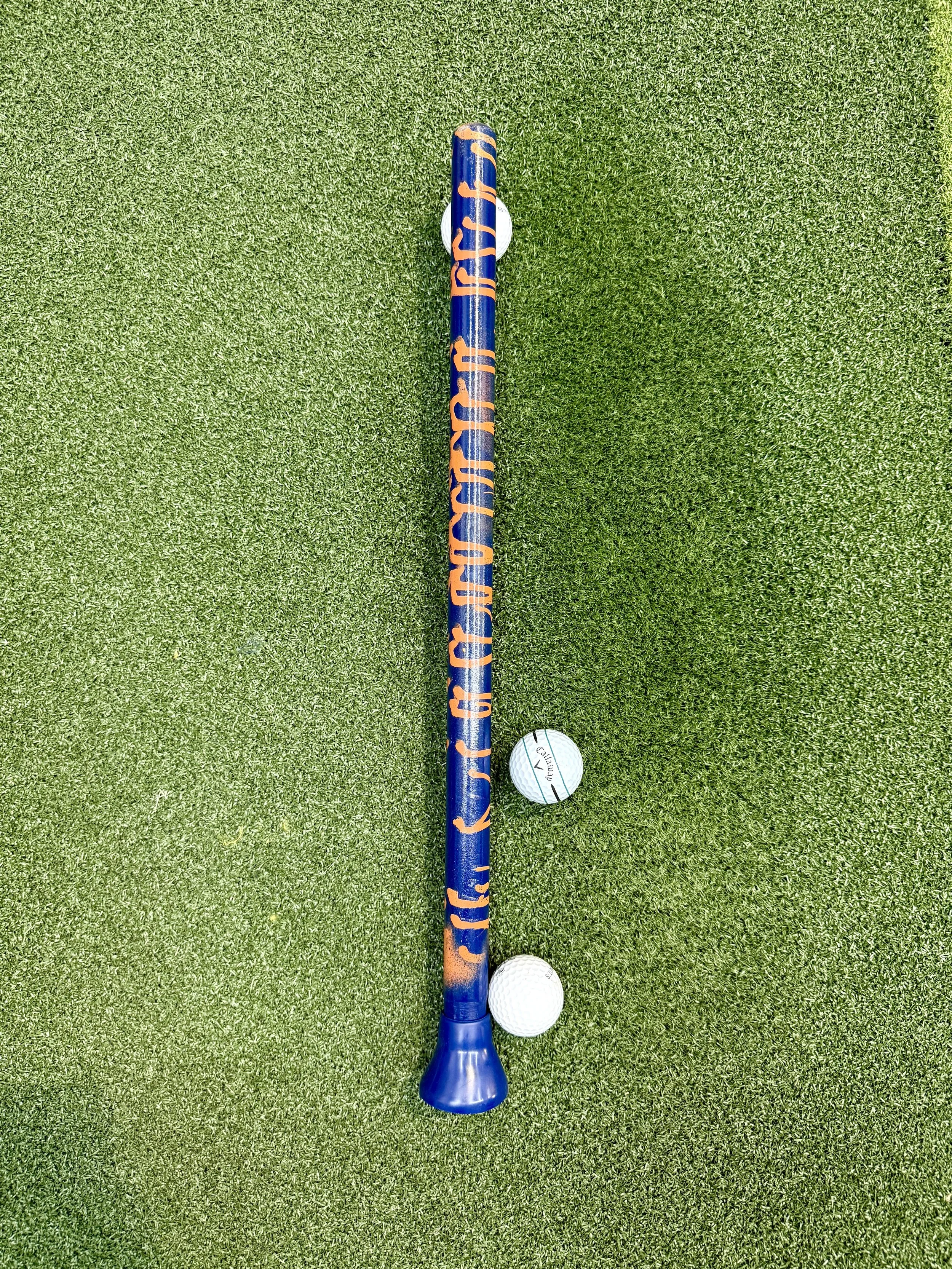 Navy blue stick with random orange stripes. Navy blue plunger. Auburn fan. Detroit Tigers fan. Chicago bears fan. Denver Broncos fan. Houston Astros fan. Edmonton Oilers fan.