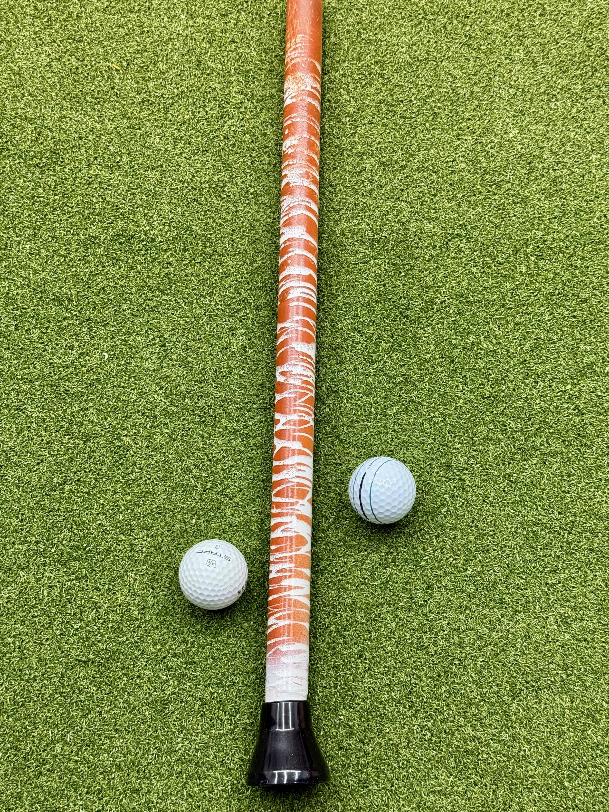 Burnt orange and white. Texas Longhorns fan. Golf ball pickup tool.