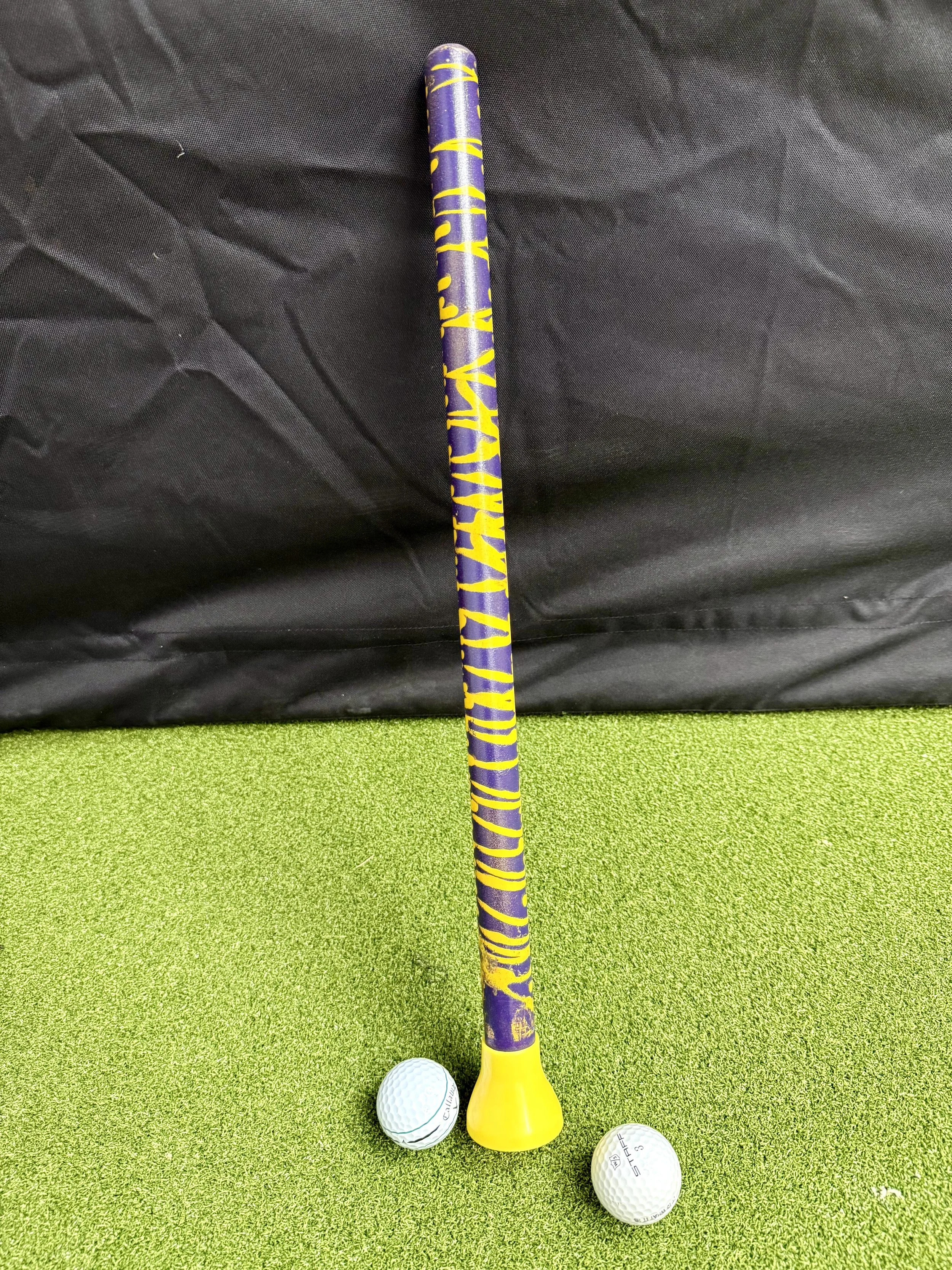 Purple and yellow striped golf ball pickup tool. LSU Tiger fan. Louisiana. Baton Rouge. Lets Geaux.