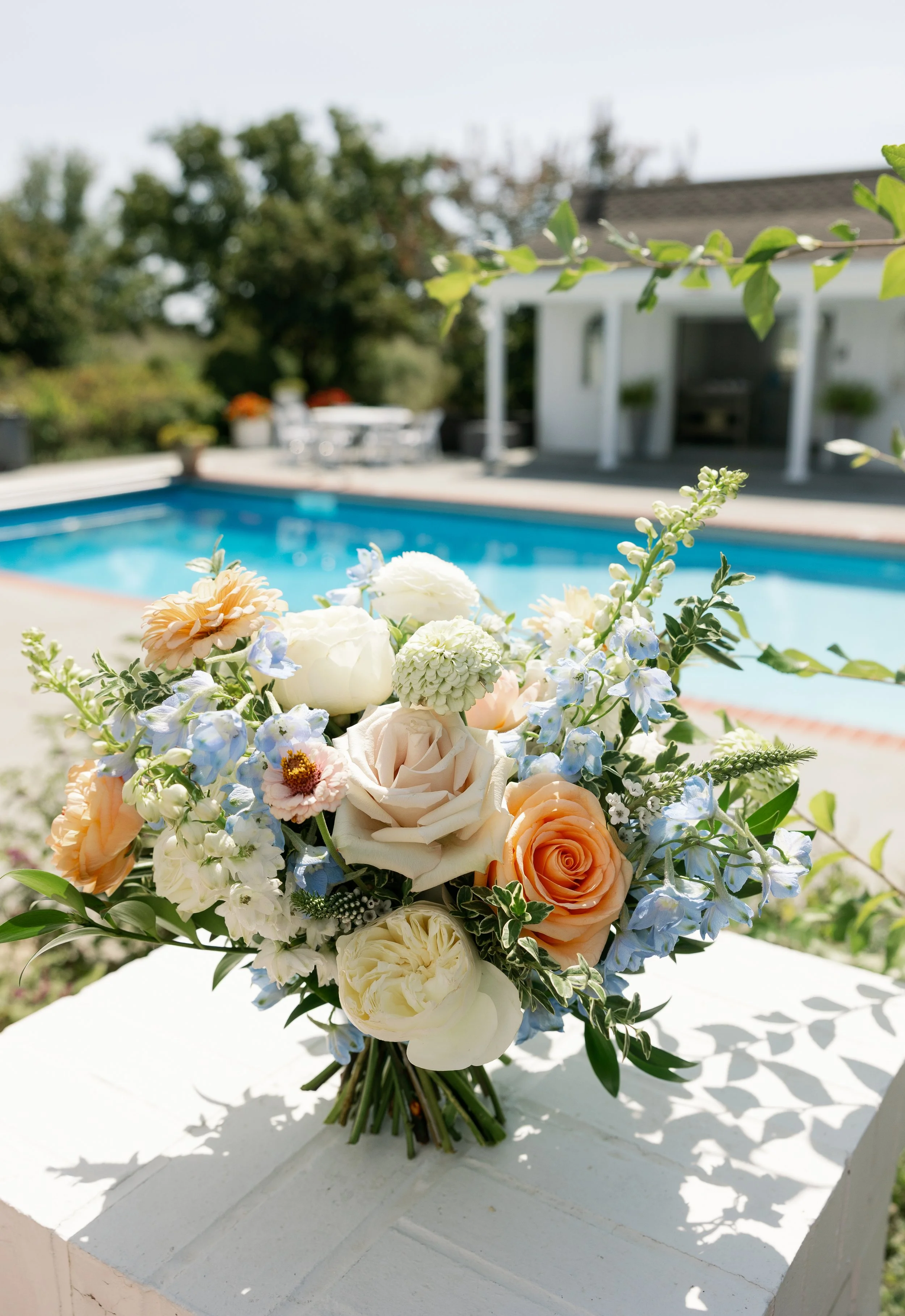 A Missouri wedding dream: pastel florals, airy textures, and a romantic setting brought together by an incredible vendor team.