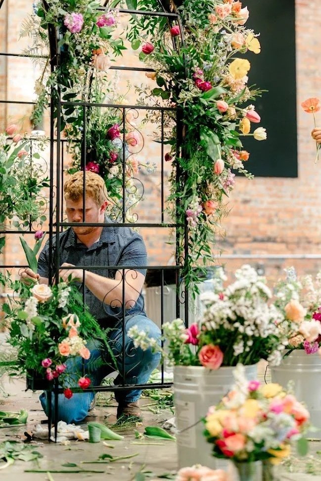 Caleb Rohrbach designing an arbor for the Williamson couple at the Millbottom in Jefferson City, Missouri. Photo by Melody Holland Photography