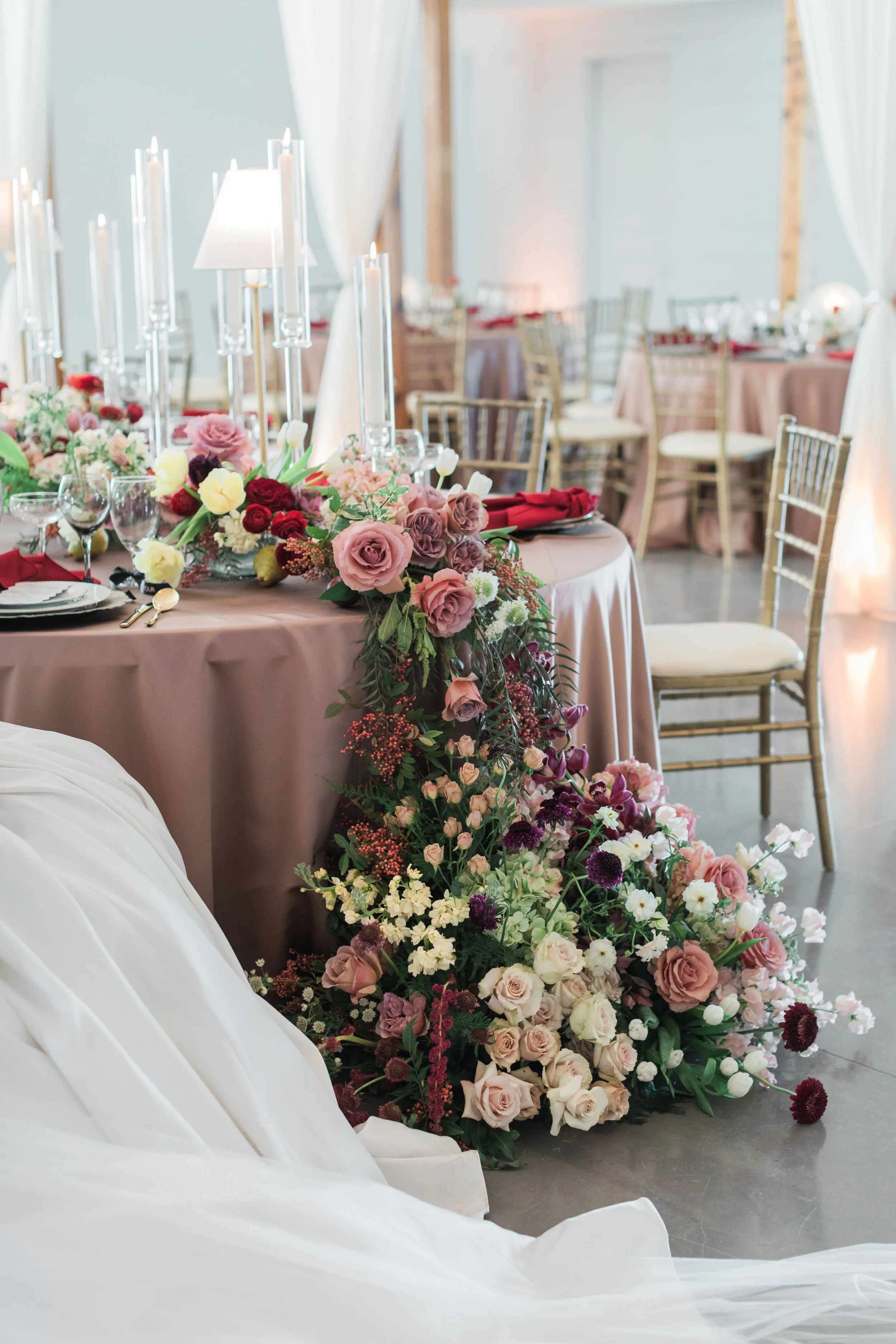 Flowers spilling off the table. Statement wedding flowers.