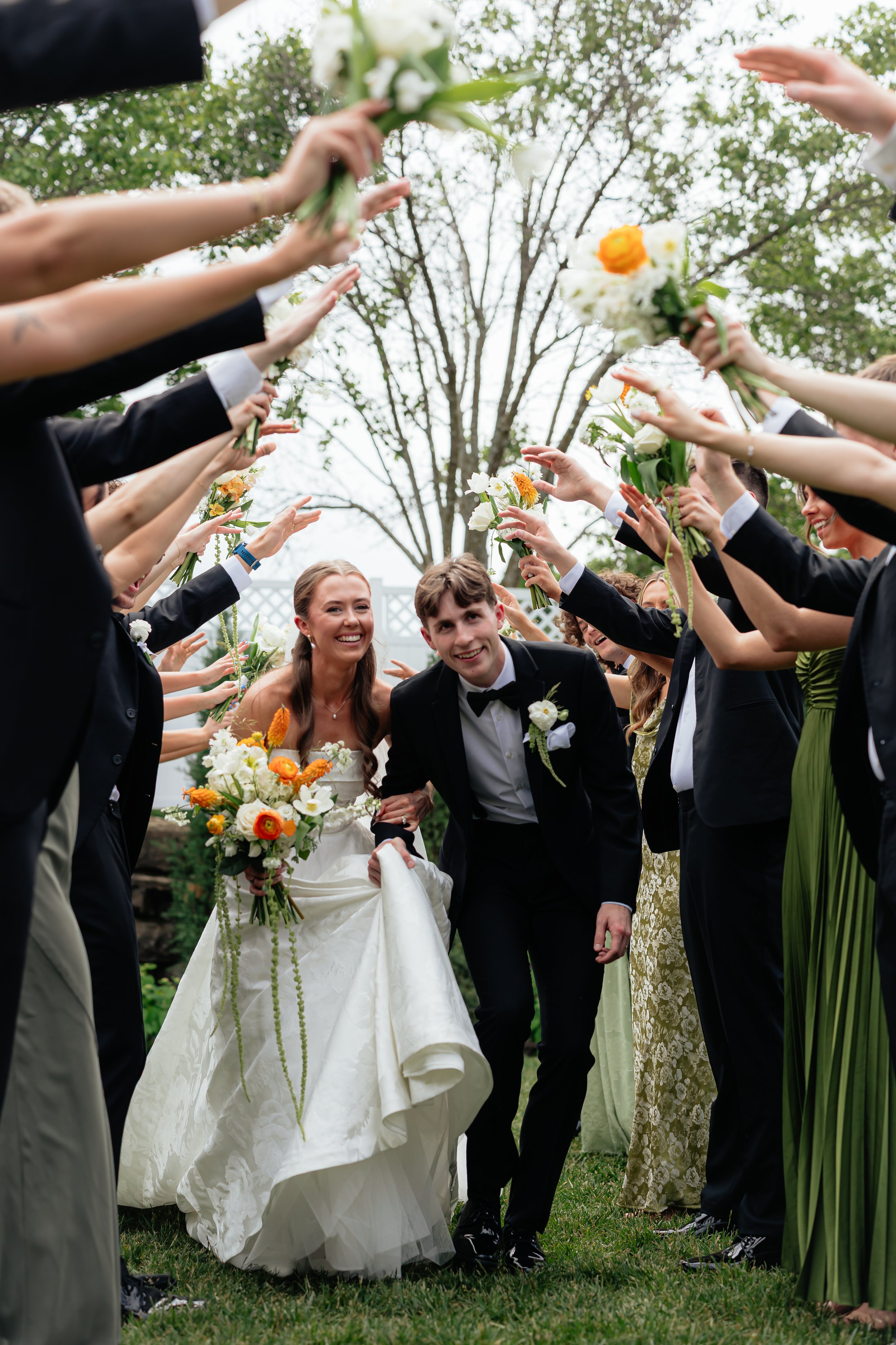 Beautiful wedding ceremony flowers designed to complement the romantic setting at The Glasshouse at River Oaks.