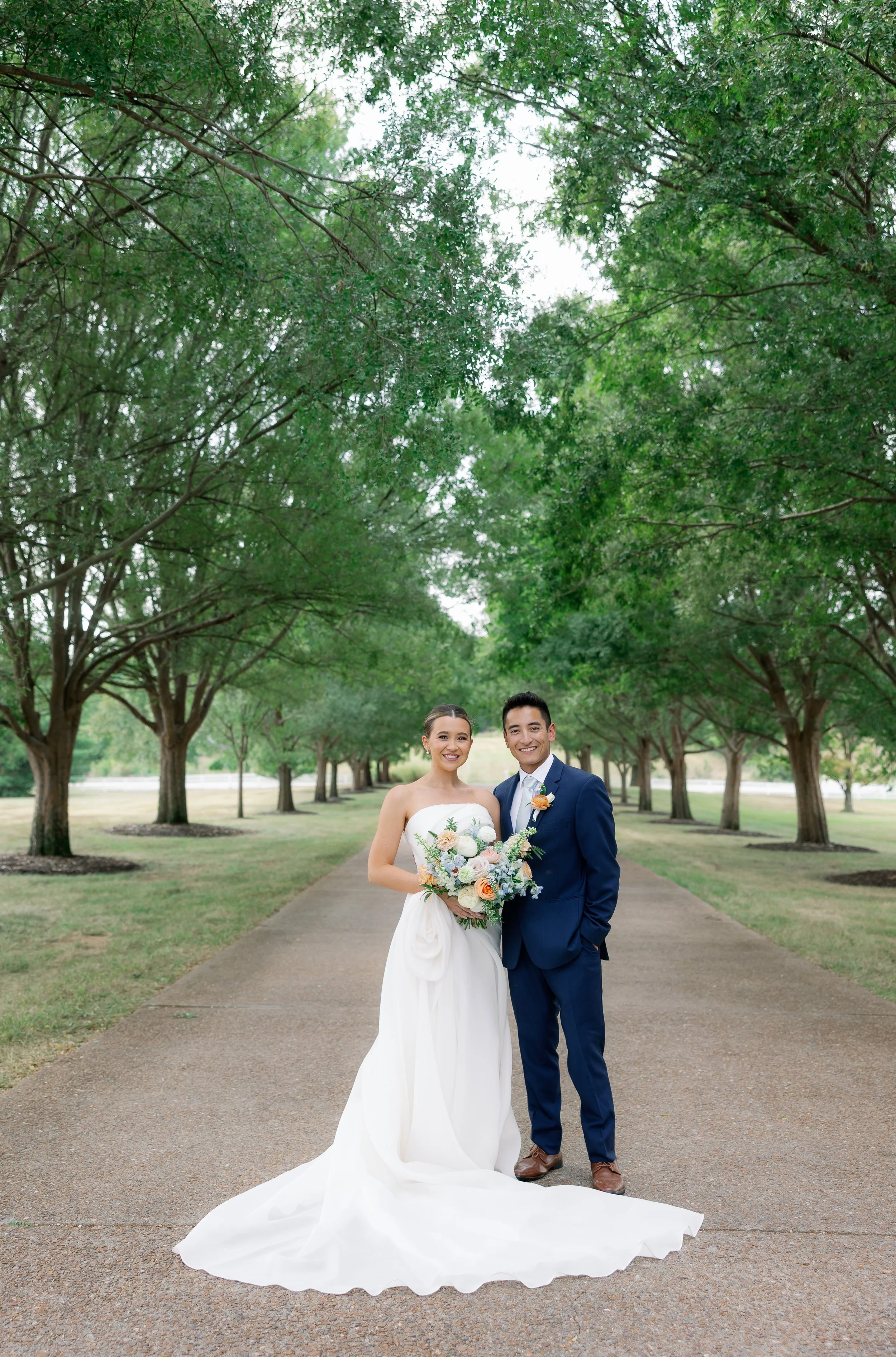 Missouri wedding couple photographed with pastel-inspired floral design for a soft and elegant look.