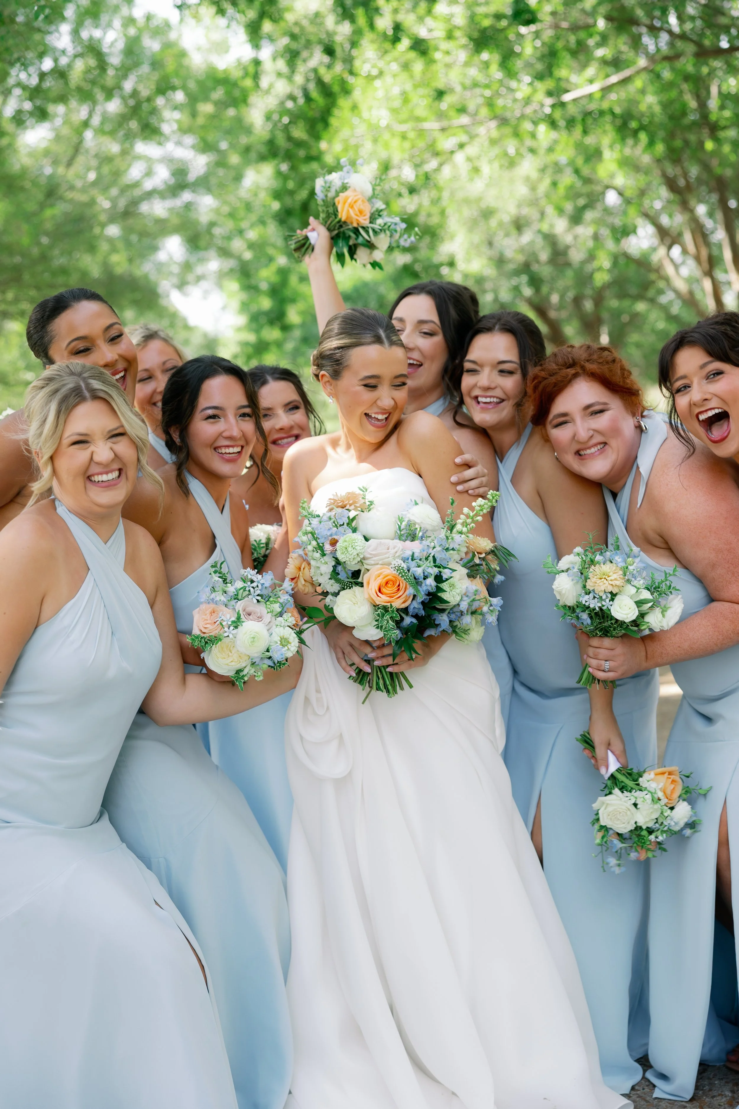 Missouri bridesmaid bouquet inspiration in soft blue and peach tones for outdoor summer weddings.