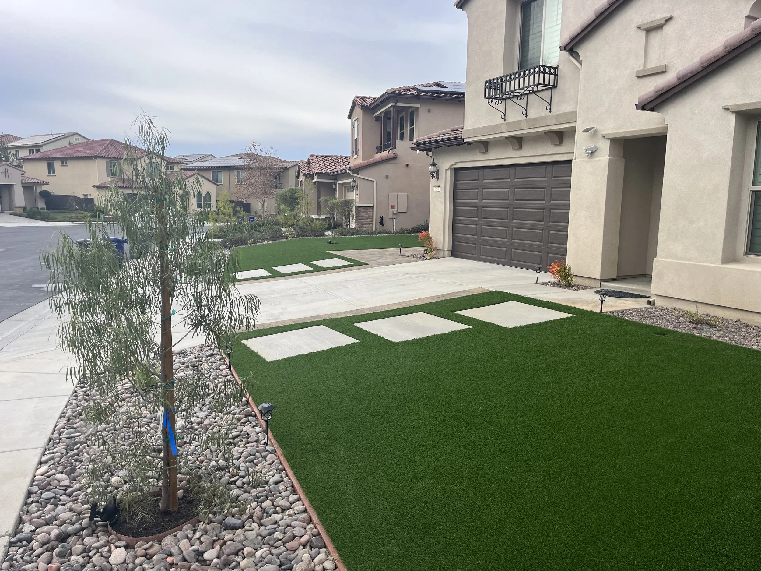 Custom artificial turf and concrete hardscape project in Vista, California