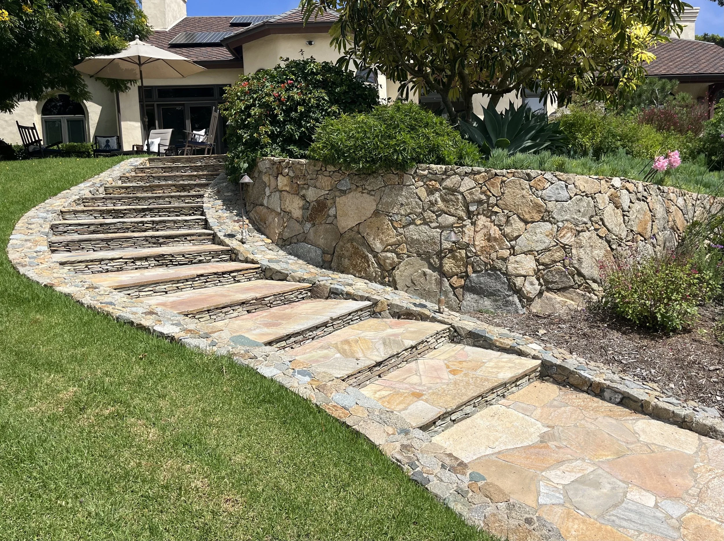Natural stone retaining wall and steps in Del Mar California