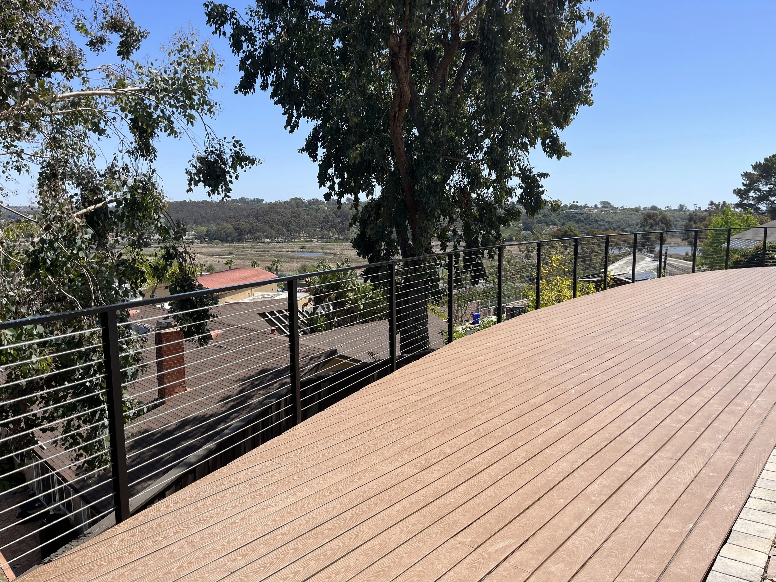 Custom outdoor deck with modern cable railing in Oceanside, CA