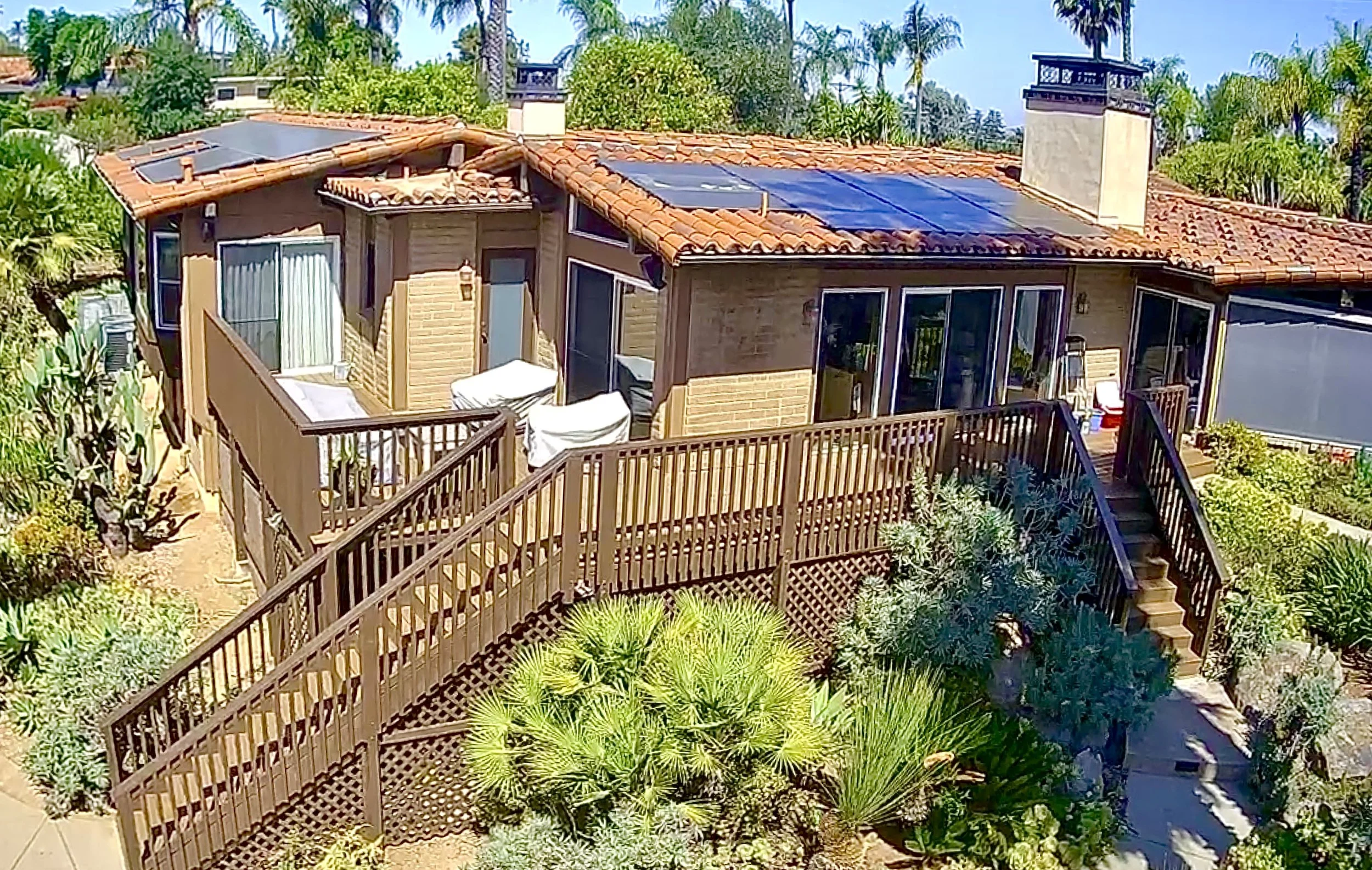 Custom elevated wood deck with wood railing and stairs in Poway, CA